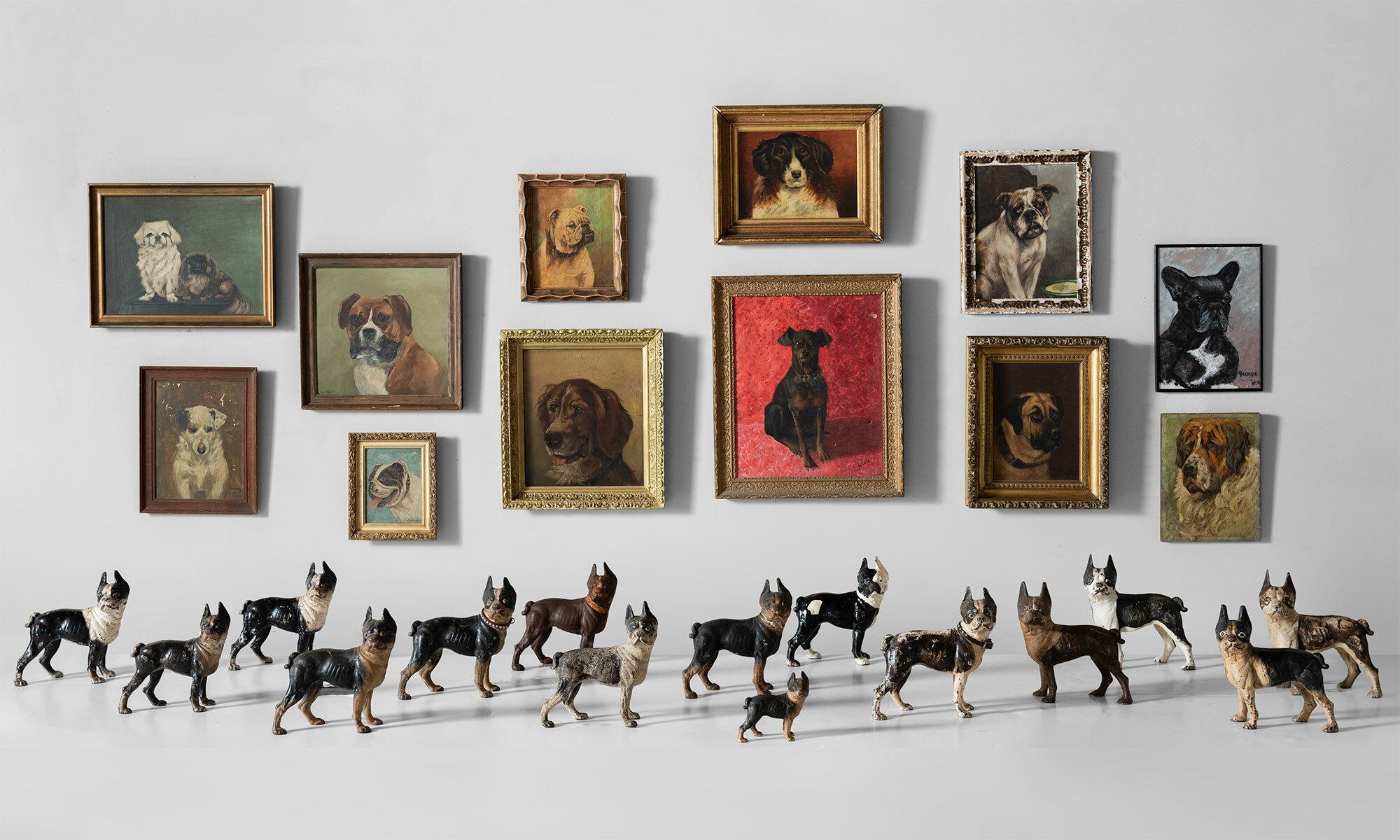 Collection of dog oil paintings and cast iron door stops, England, circa 1880-1960.

A lively assortment of (12) portraits and (15) hand painted, cast iron doorstops. The paintings include original frames and the doorstops come in a variety of