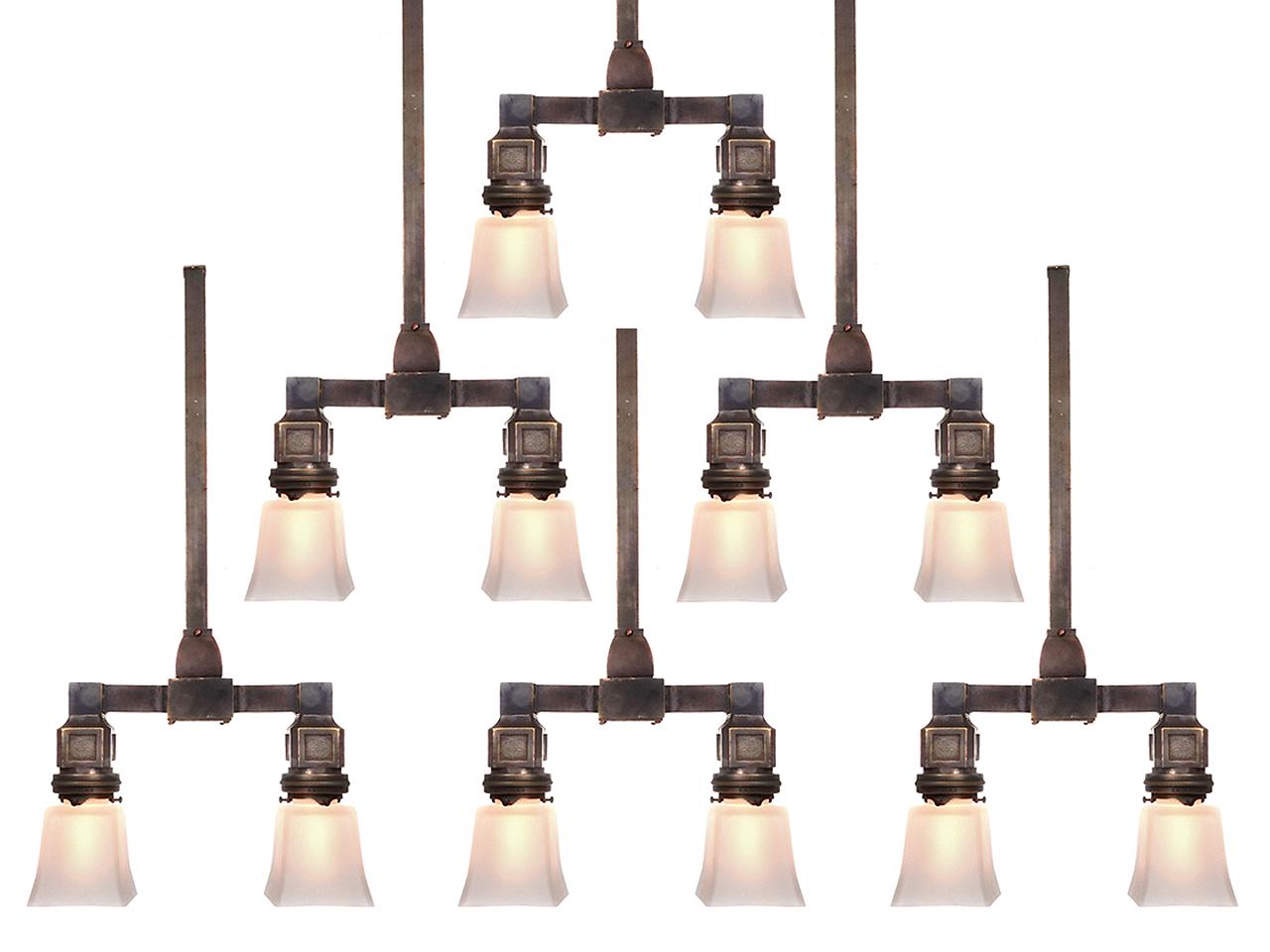 This is a matching collection priced per fixture so you can buy only one or all. They are signed and date to the early 20th Century. These cast bronze double New York City subway station fixtures are perfect for kitchen islands or dining room