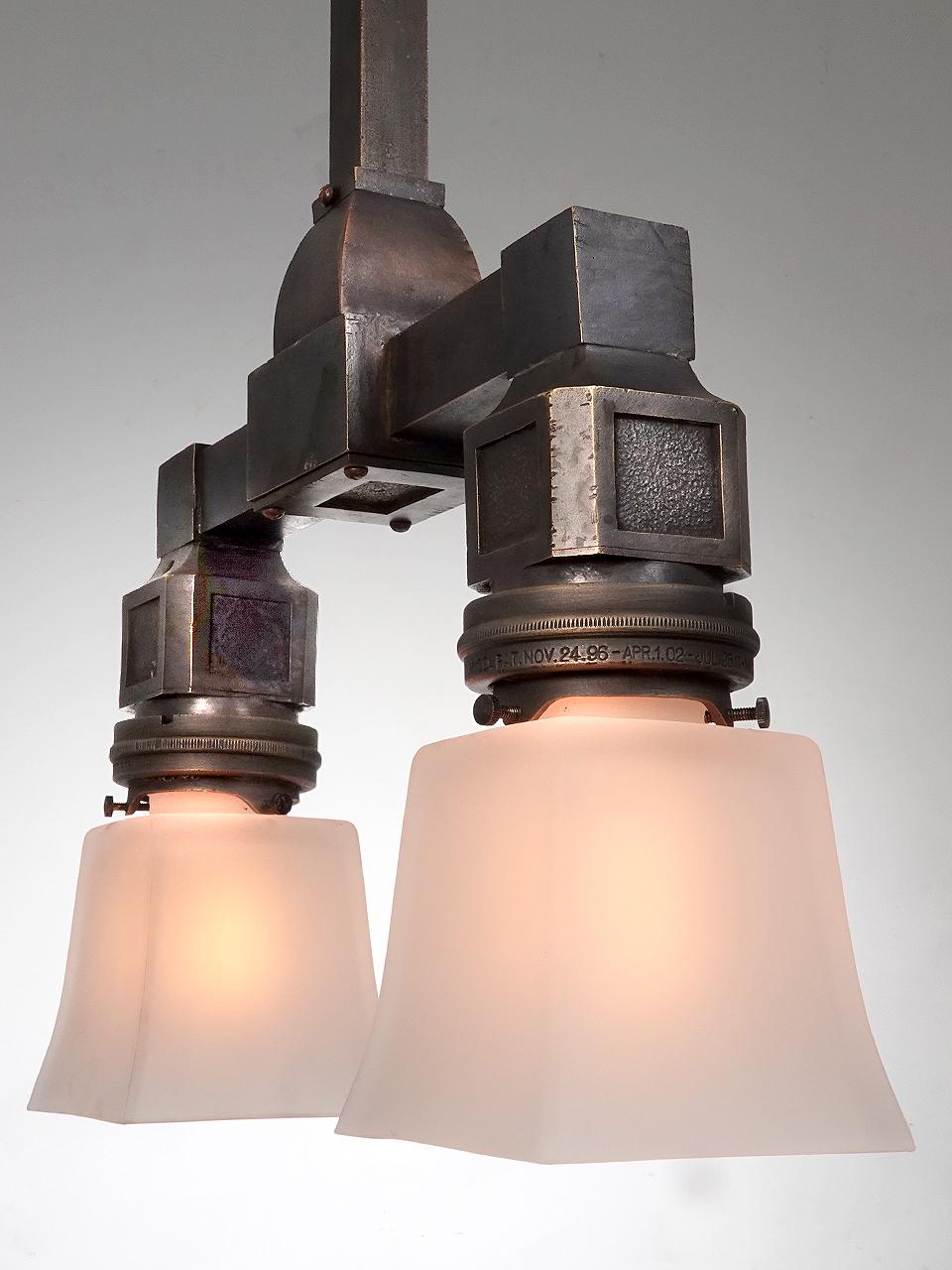 20th Century Collection of Early NYC Bronze Double Subway Double Pendents For Sale