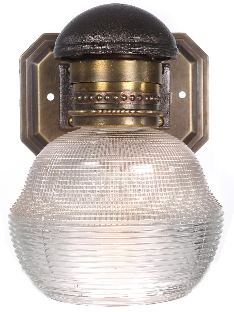 This is an early 20th century cast bronze and iron railroad car sconce. They were designed and fabricated specifically for RR use. The screw on shade holder was designed to safely hold glass on a moving train. Each has a beautiful and unique mixed