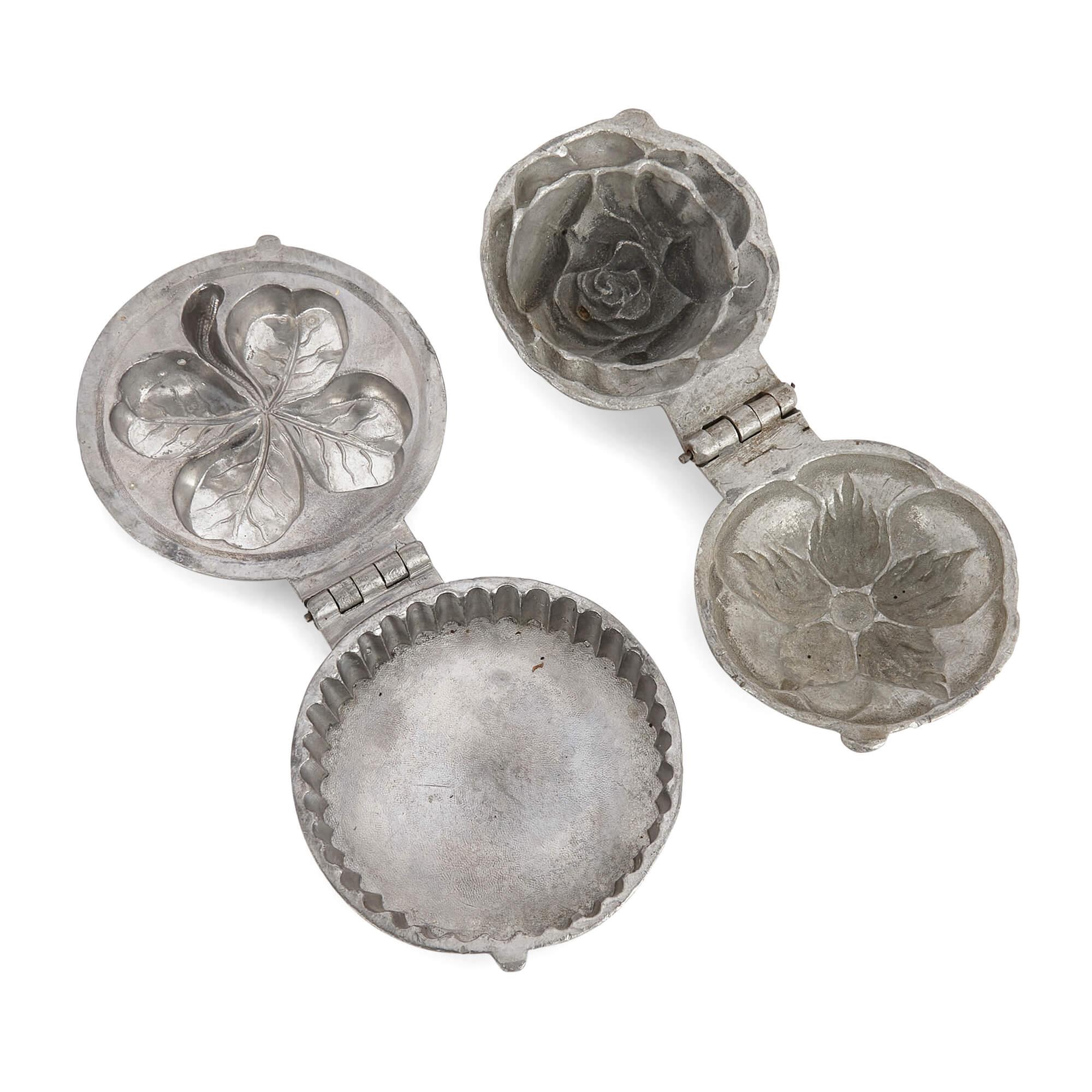Collection of eight American pewter ice cream moulds 
American, Early 20th Century 
Largest: Height 11cm, width 9cm, depth 7cm
Smallest: Height 4cm, diameter 9.5cm

Popular from the mid-19th century onwards, ice cream moulds were seen as a way of