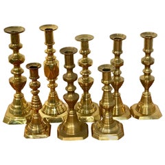 Collection of Eight Antique English Brass Candlesticks