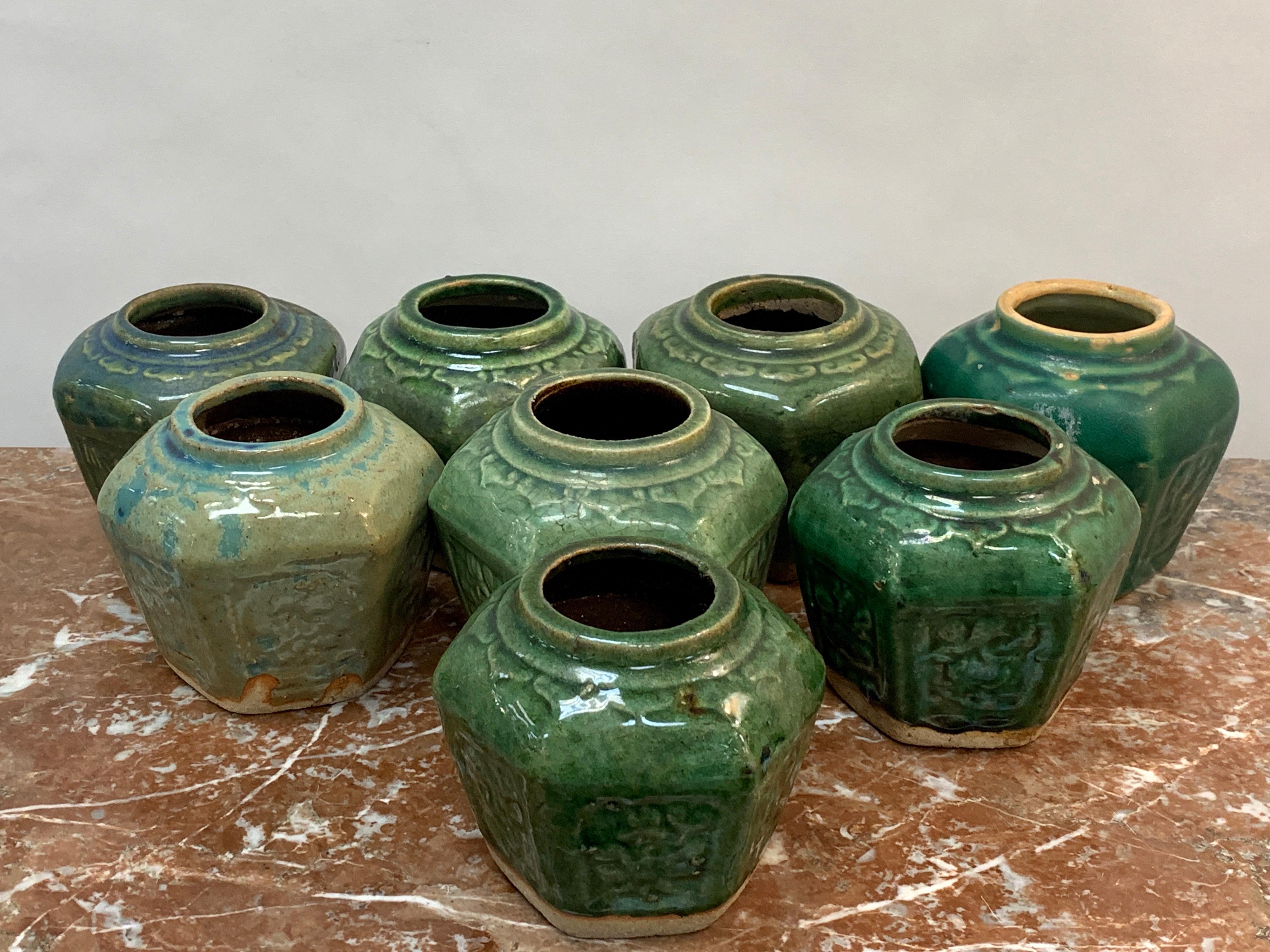 Collection of Eight Chinese export hexagonal vases in shades of green
Each one with incised decoration with various hues of green glazes. Some bearing remnants of import tags.   
     
     