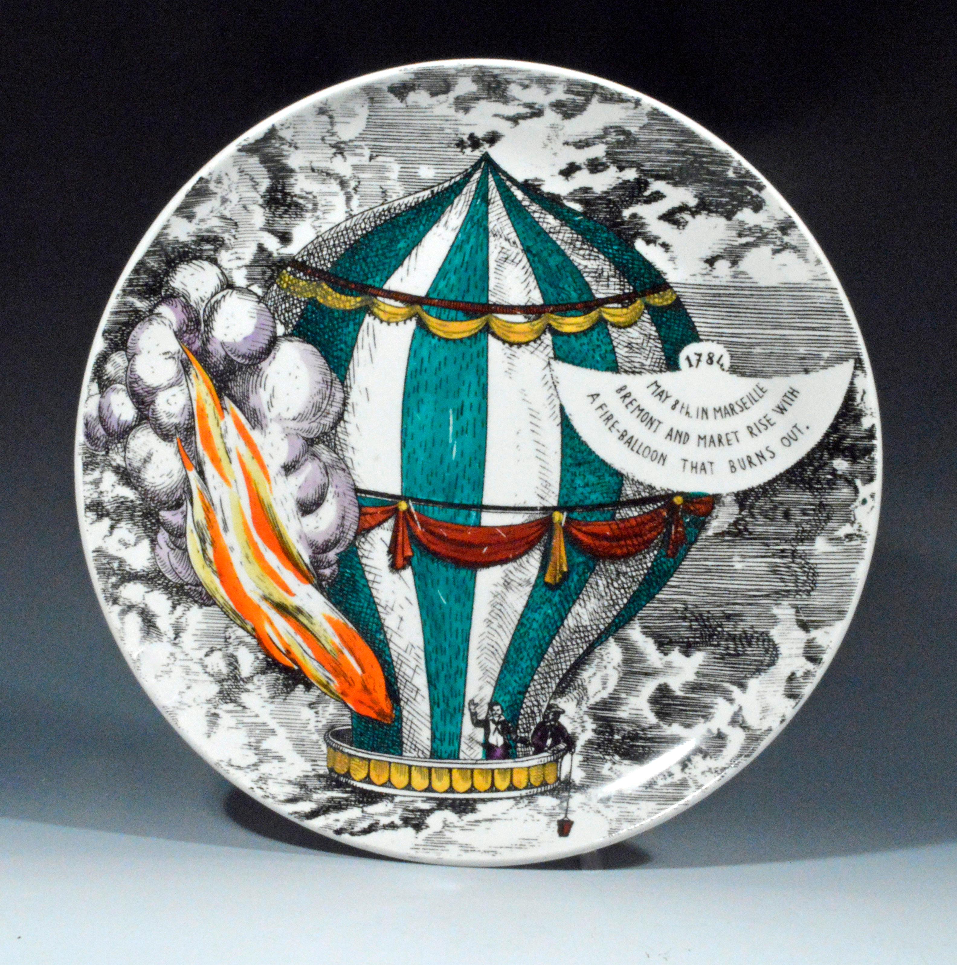 Eight Vintage Piero Fornasetti Plates, 
Mongolfiere (hot air) Design,
1950's

The large Piero Fornasetti plate depicts a large hot air balloon with a panel describing the image.  

1804
Dec. 16th. Fire Balloon for
Napoleon's Incornation. Soared