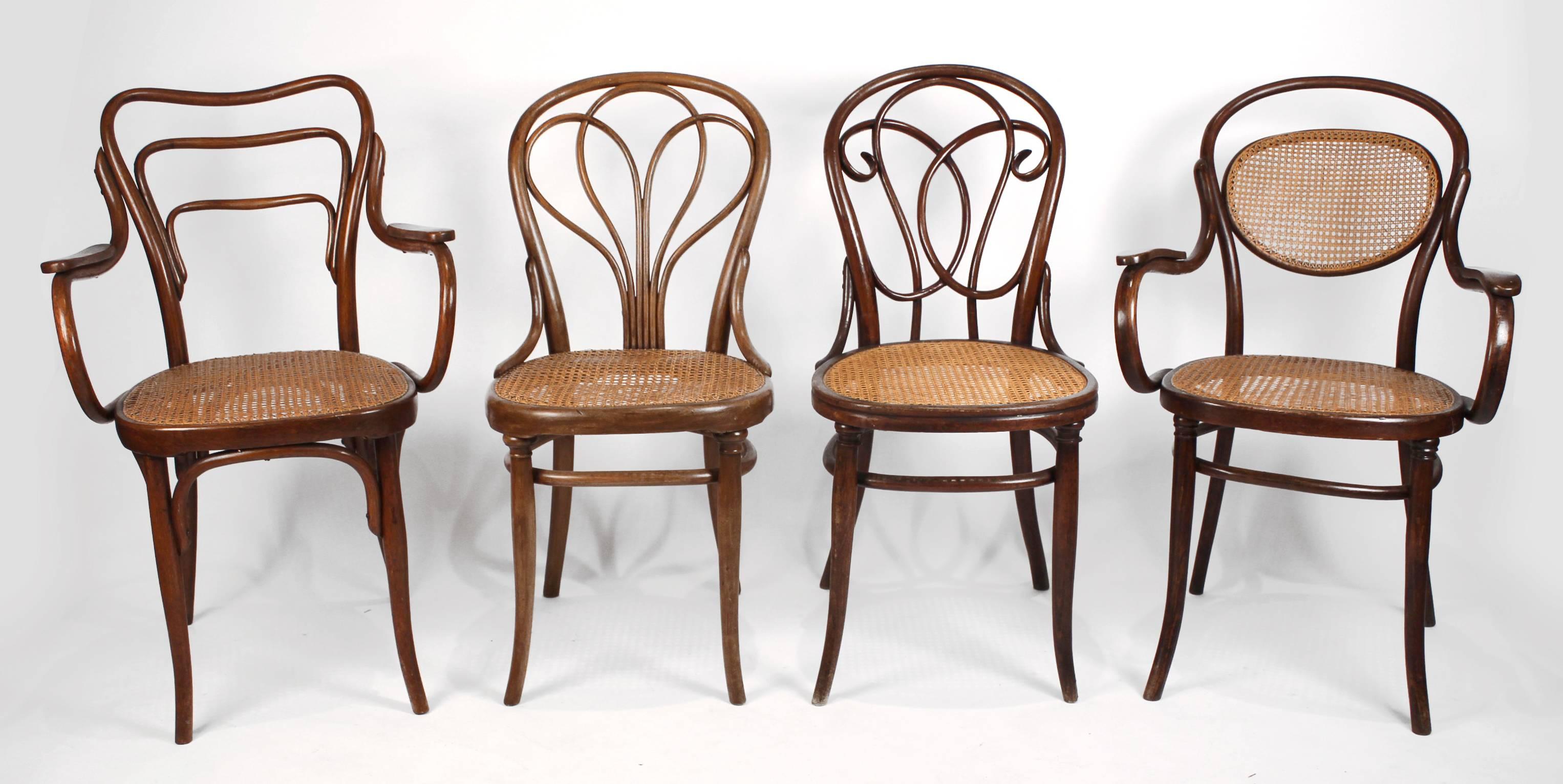 From the estate of a prominent Dallas architect, this set of eight bentwood Austrian dining chairs was carefully curated over the years and is comprised of two armchairs and six side chairs. A number of the chairs retain their original labels. They