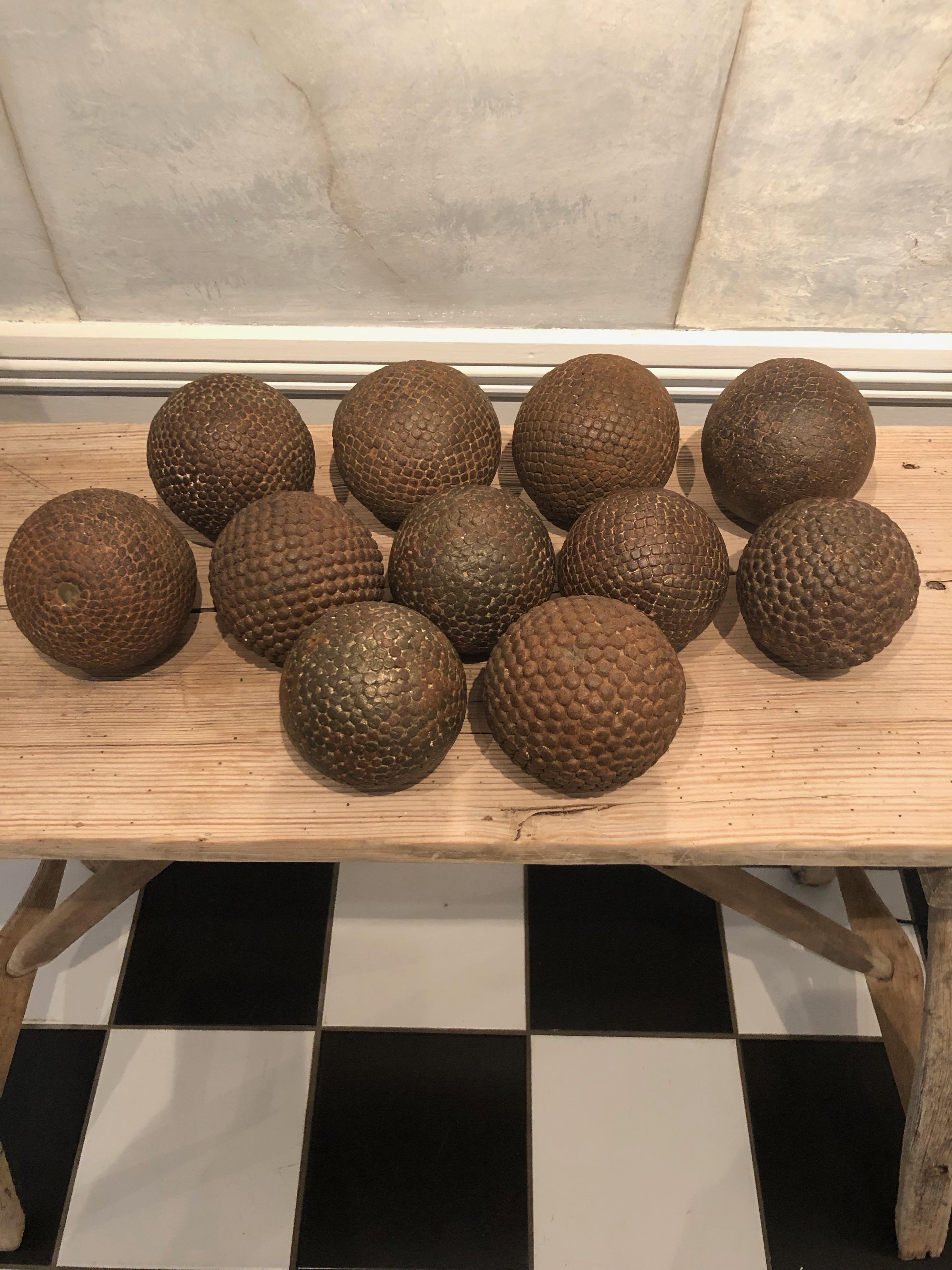 Boules are used to play Pétanque, the French equivalent of Boccé, and this collection is stunning. Made from wood with iron studs for durability and dating to the 1840s, the set comprises two different sizes, 9 larger and 2 smaller ones and all