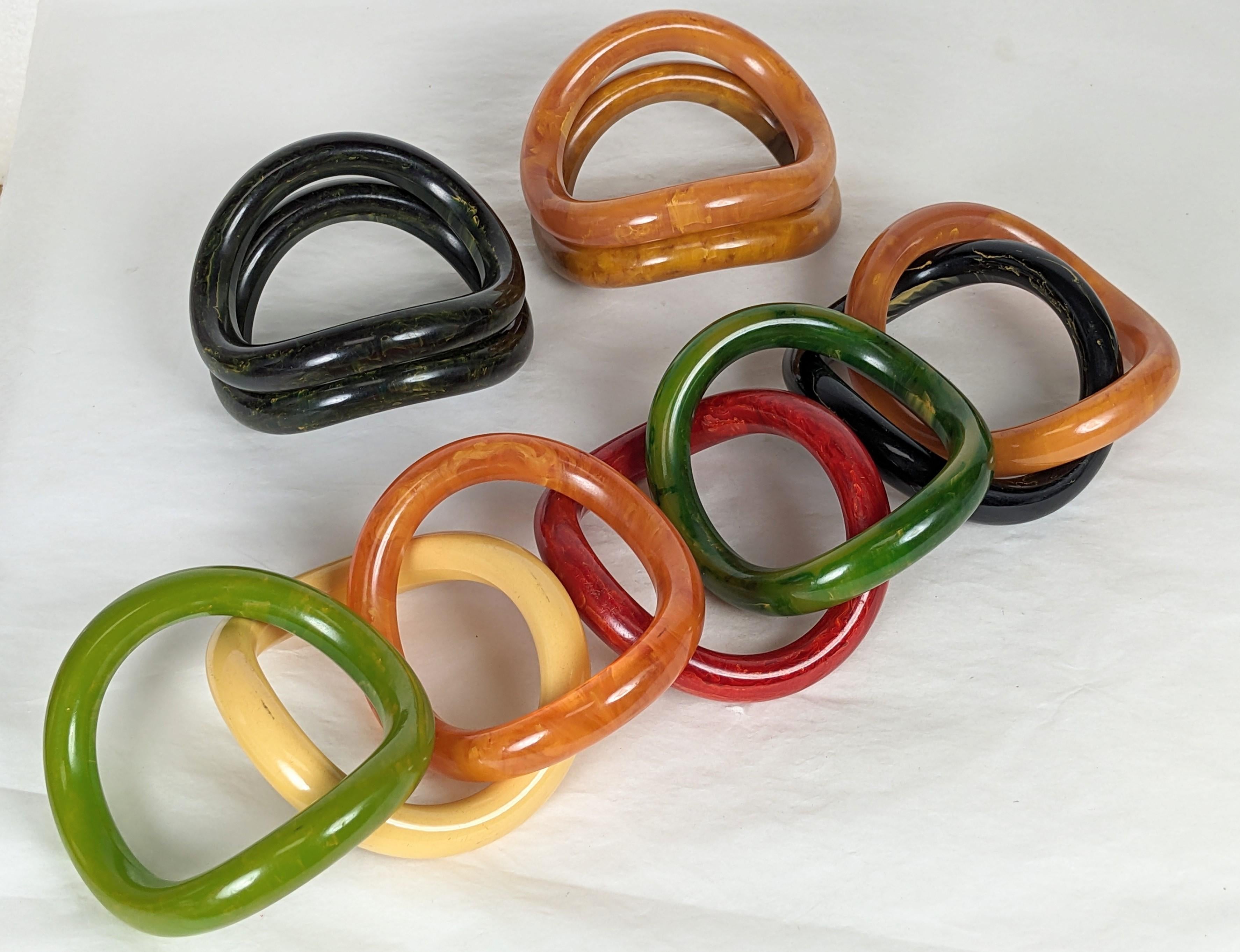 Art Deco Collection of End of Day Bakelite Squiggle Bracelets For Sale