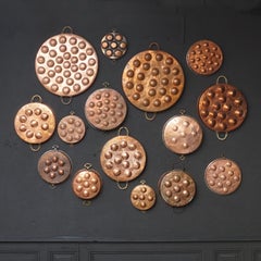 Collection of Fifteen 19th Century French Copper Egg Poacher or Escargot Pans