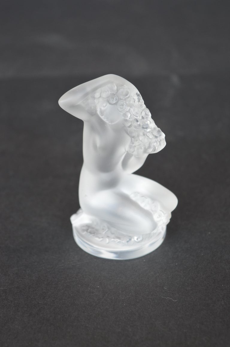 20th Century Collection of Figurines and a Pair of Candle Sticks by Lalique For Sale