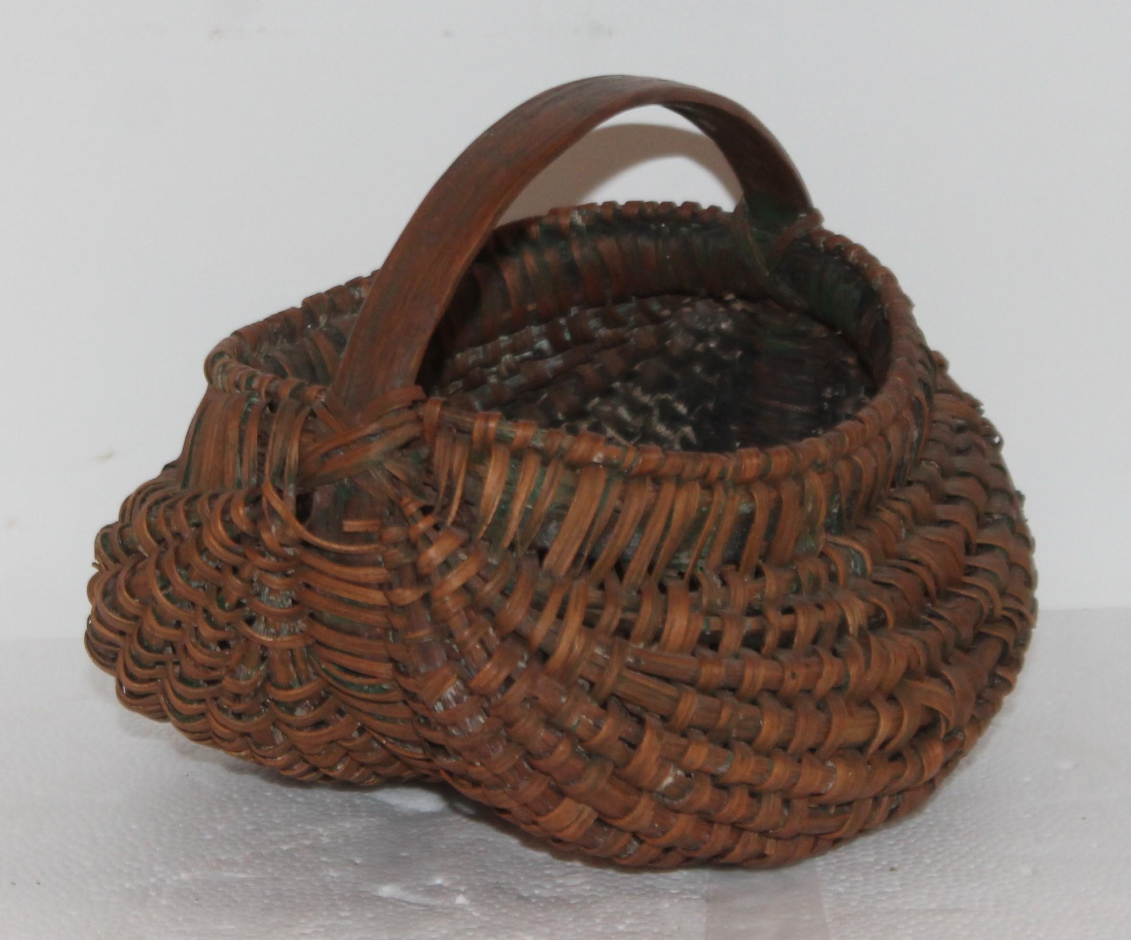 Buttocks basket 7.5 x 7 x 6 This collection of five very early baskets are all from Pennsylvania and in very good condition.
Small oval apple basket 10 x 8 x 7.5
Round fruit basket - 9.5 diameter x 8.5
Picnic basket - 11 x 11.5 x 10.5.
 