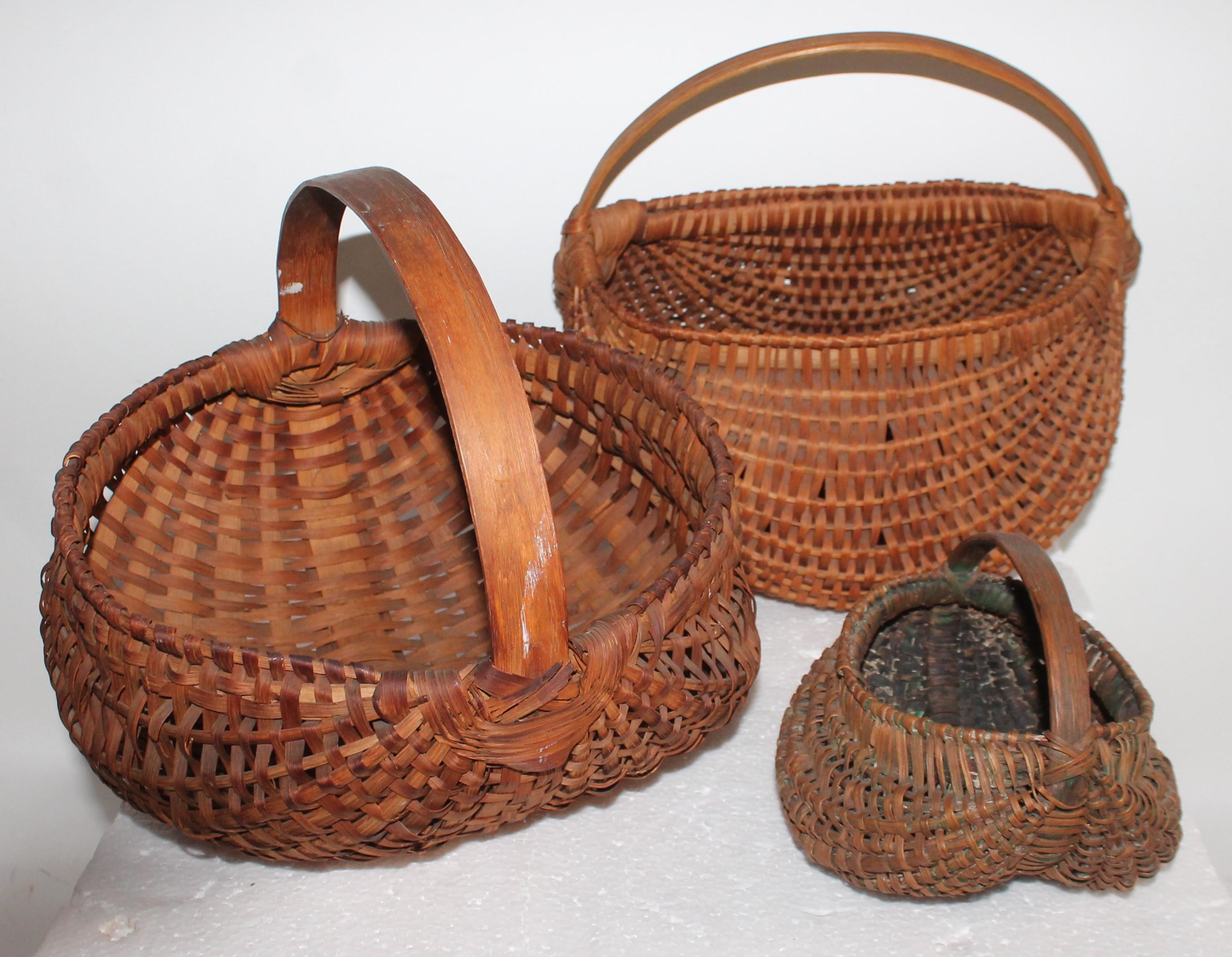This collection of five 19th century baskets are in fine condition, mostly Pennsylvania origin. There are three round bottom (buttocks baskets) and two other round shaped early with amazing untouched patina. Selling as a collection of five.