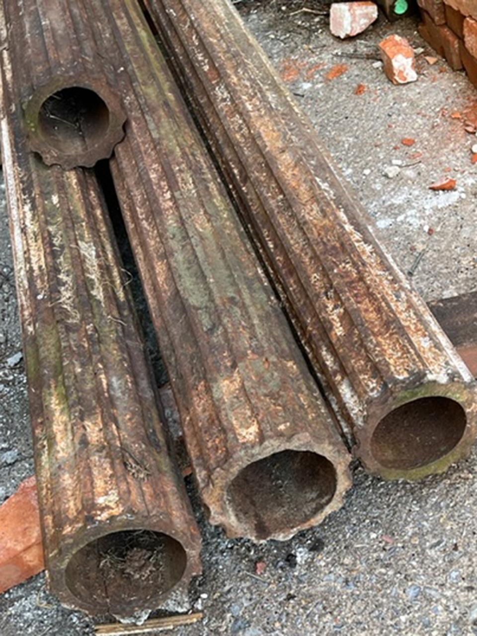 Rustic Collection of Fluted Iron Columns For Sale