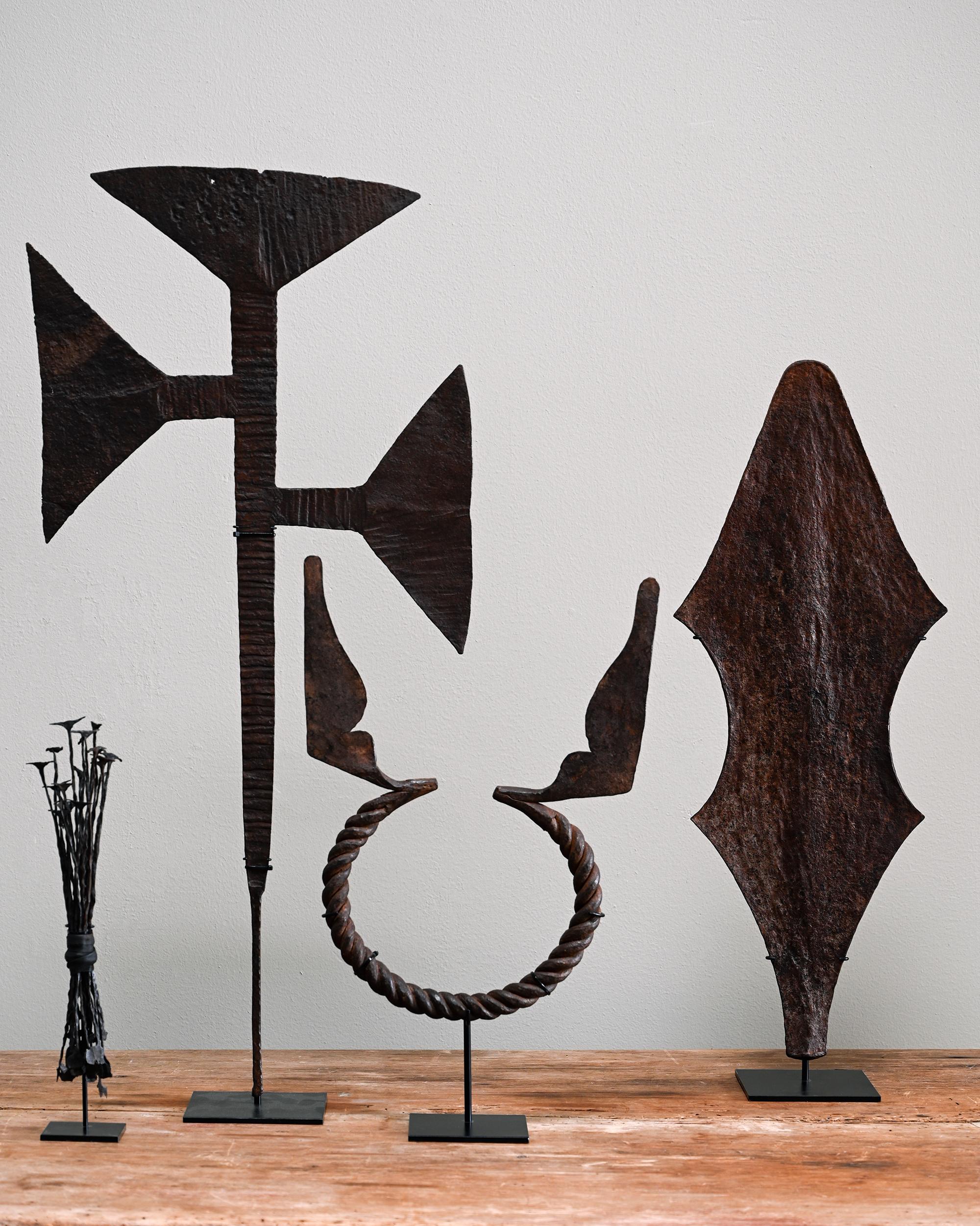 Fine collection of four 18th - 19th century African Tribal currency's on stand from the world renowned collector and author Roberto Ballarini. 

From left to right

1. Toma, Kissi (Kisi,Ghisi, Gizi) Currency in forged iron made by the Toma tribe