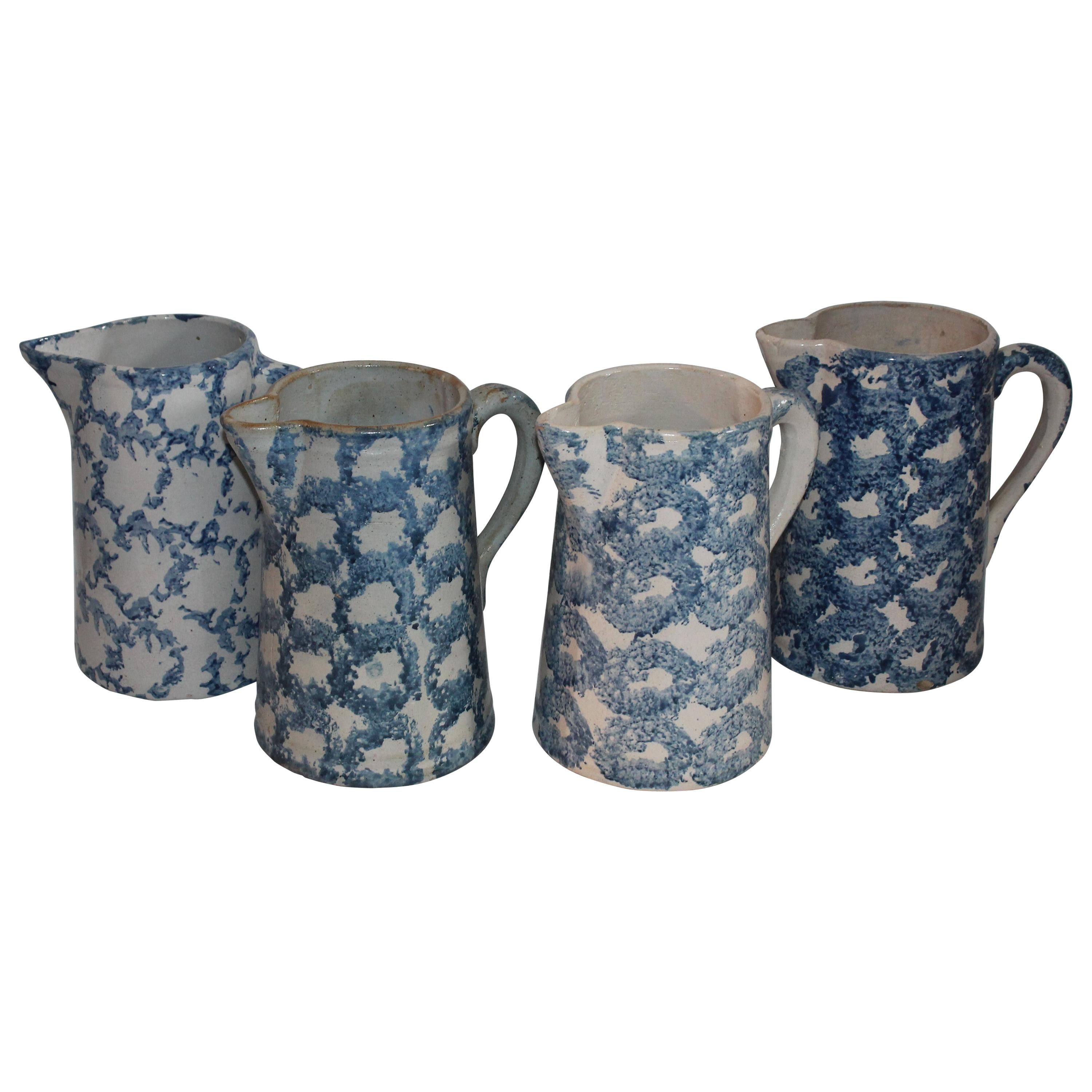 Collection of Four 19th Century Design Sponge Ware Pitchers