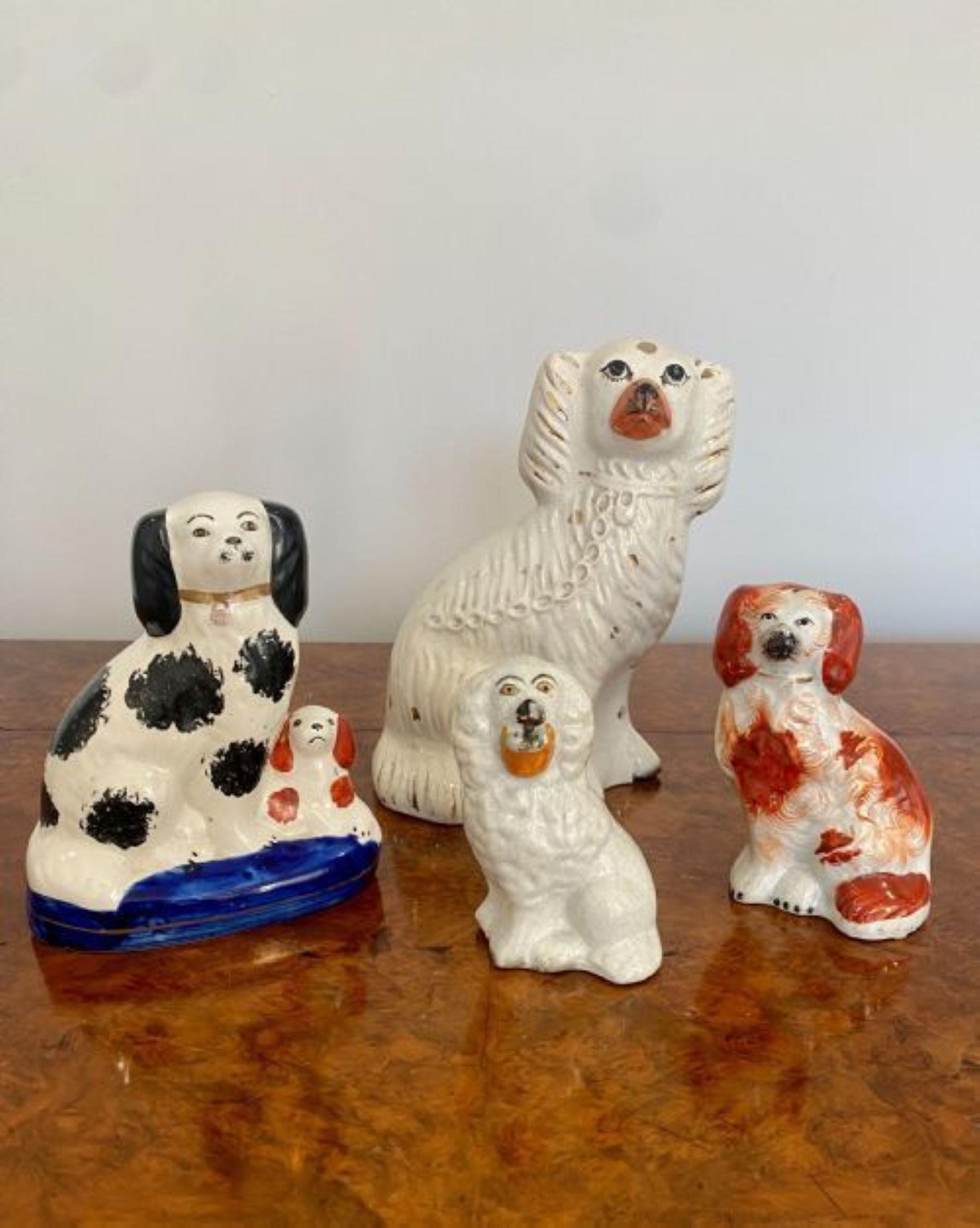 Collection of four antique quality Staffordshire hand painted Spaniels.
Four quality Staffordshire Spaniel dogs seated in wonderful black, red, white and blue colours. 