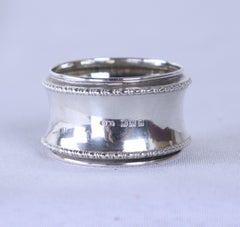 Collection of Four Assorted English Hallmarked Silver Napkin Rings, Birmingham