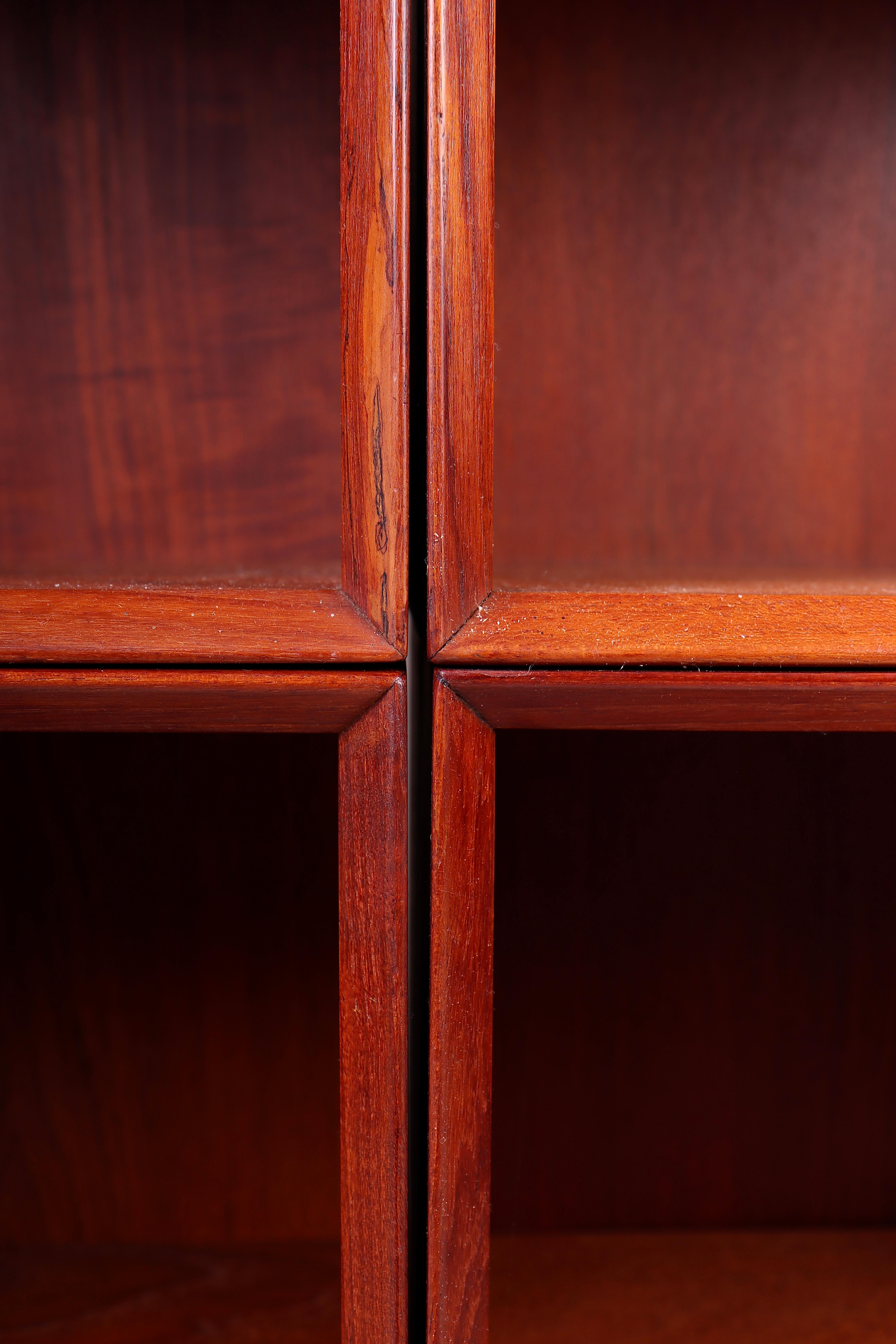 Set of 4 matching bookcases in solid teak. Designed by Peter Hvidt & Orla Mølgaard in 1960s. Made in Denmark. Great original condition.