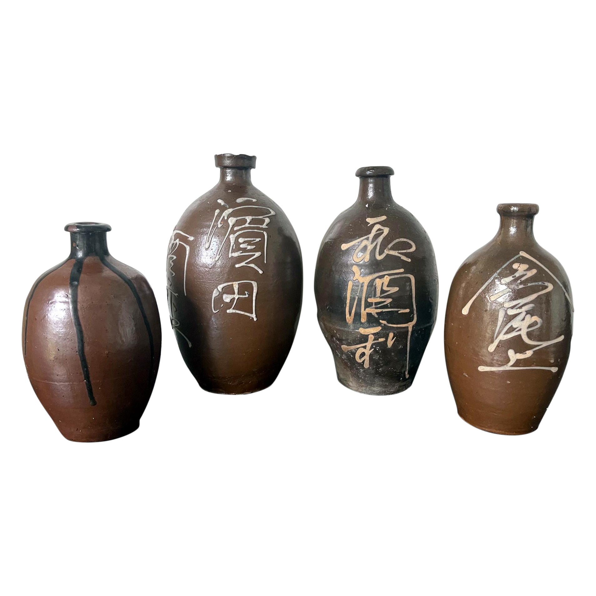 Collection of Four Japanese Tamba Tokkuri Sake Bottles