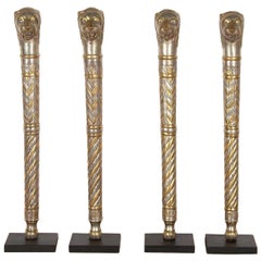 Collection of Four Lion Head Figures
