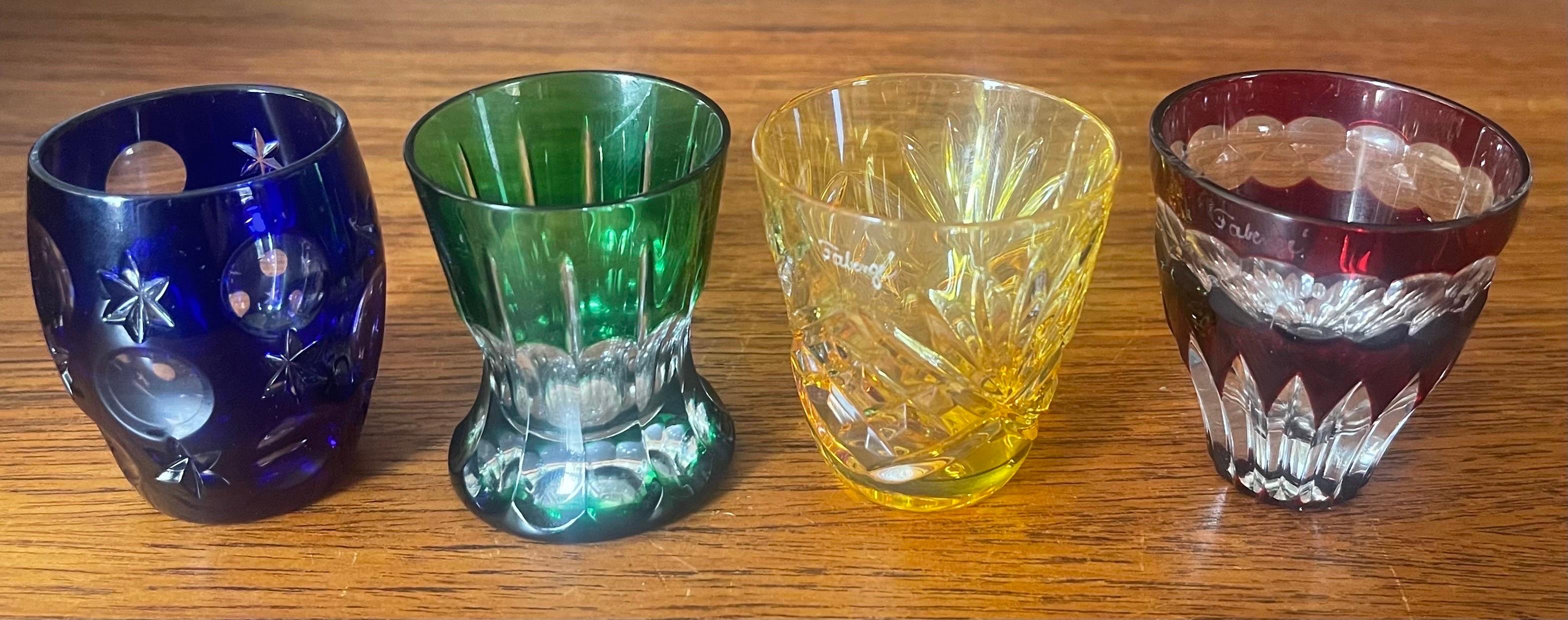 A collection of four miniature imperial glasses and case by The House of Faberge, circa 1990s. The glasses are in very good condition with no chips or cracks and each one measures approximately 2.5