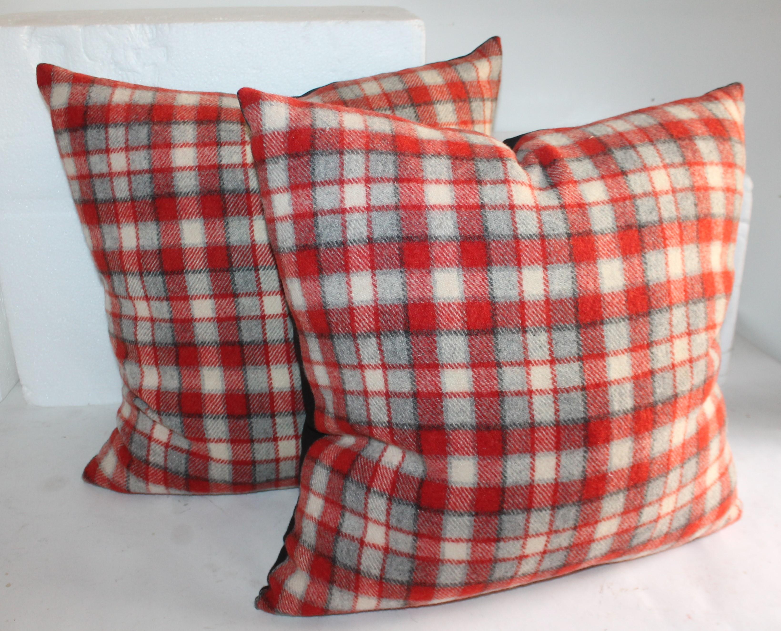Collection of amazing plaid camp blanket pillows with red, gray, cream and black stripes. These are beautiful subtle wool pillows.