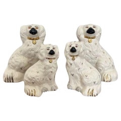 Vintage Collection of four quality Royal Dolton seated spaniels 