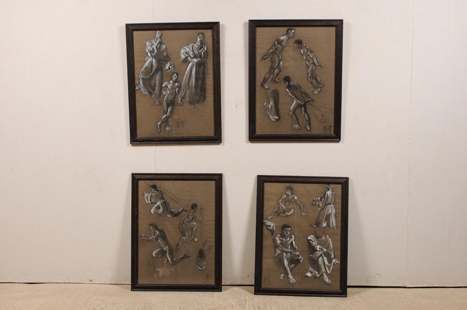 A collection of four European charcoal studies from the mid-20th century in matching wood frames. This set of vintage framed wall art feature charcoal sketches of nude and robed male figures, in various depictions of seating and motion. The sketches