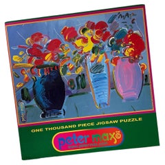 Colección de cuatro puzzles Pop Art de Peter Max sin abrir, años 90