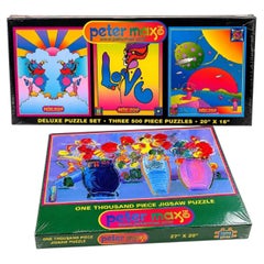 Colección de cuatro puzzles Pop Art de Peter Max sin abrir, años 90