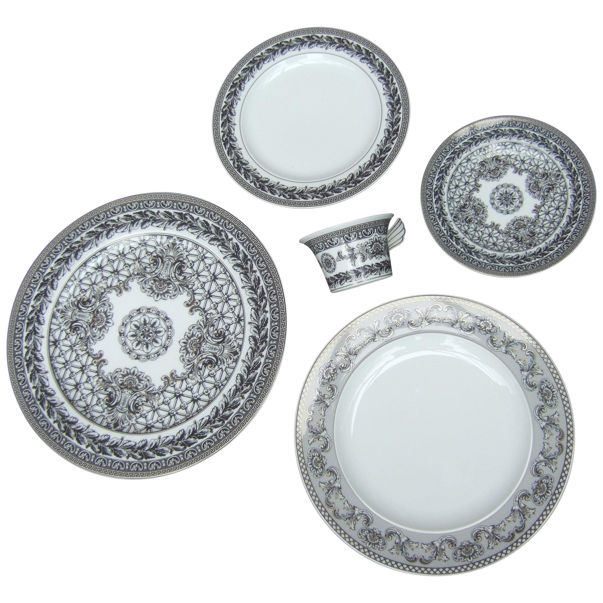 Collection of Versace for Rosenthal four porcelain dining plates c 1990s
The collection of four white porcelain plates are in various sizes and designs
They all have black stenciled designs, a few with Versace's signature Greek key border design.