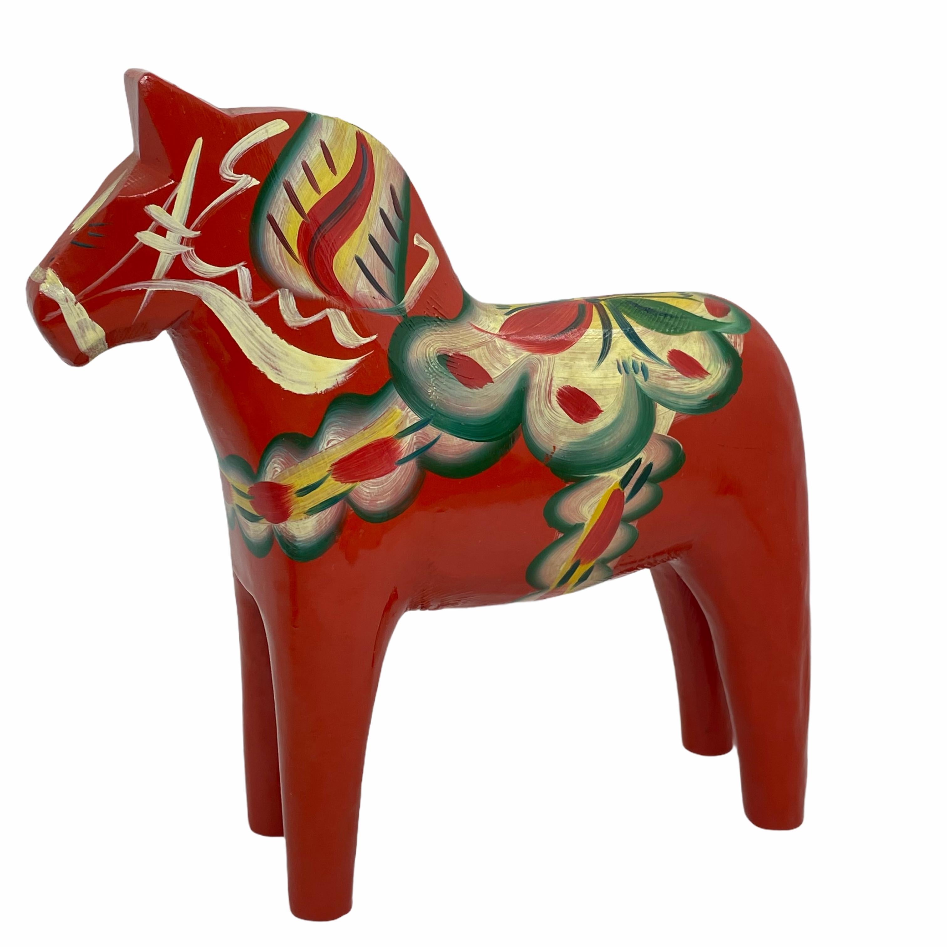 This offer is for a collection of four Swedish Dala Horses by Nils Olsson and Tillv. Erik Pell. These are hand carved painted wood. The tow larger ones are approximate 6 3/4