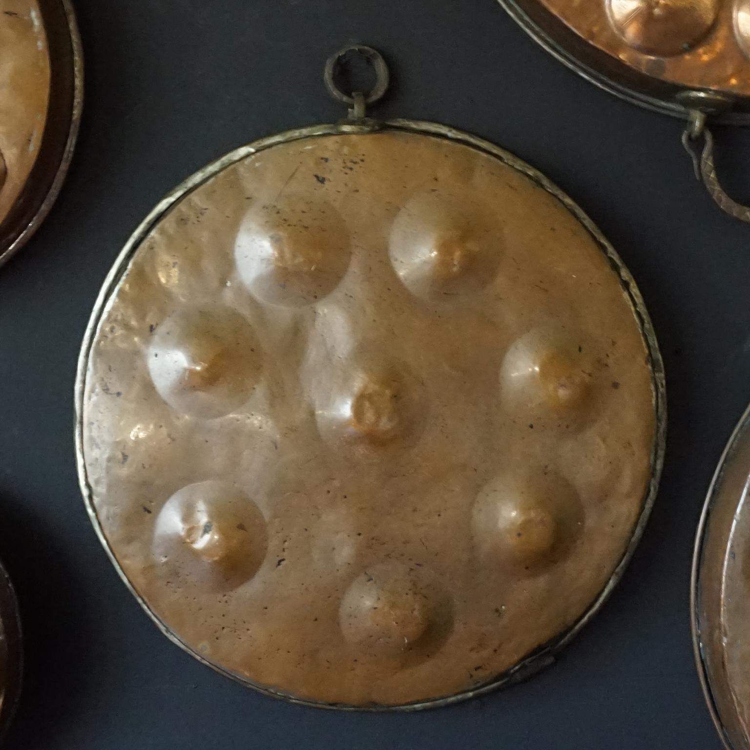 Collection of Fourteen 19th Century French Copper Egg Poacher or Escargot Pans For Sale 6