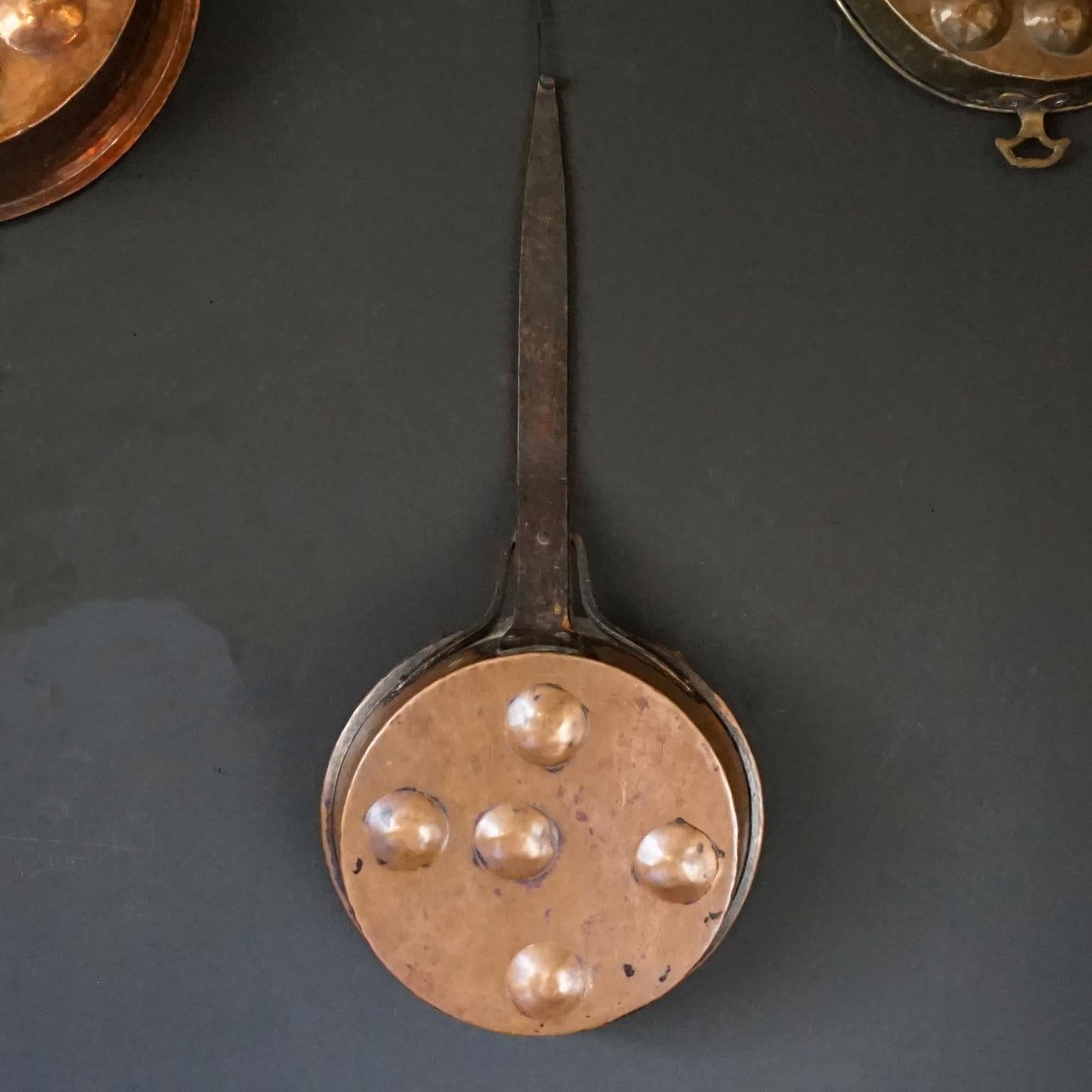 Collection of Fourteen 19th Century French Copper Egg Poacher or Escargot Pans For Sale 9