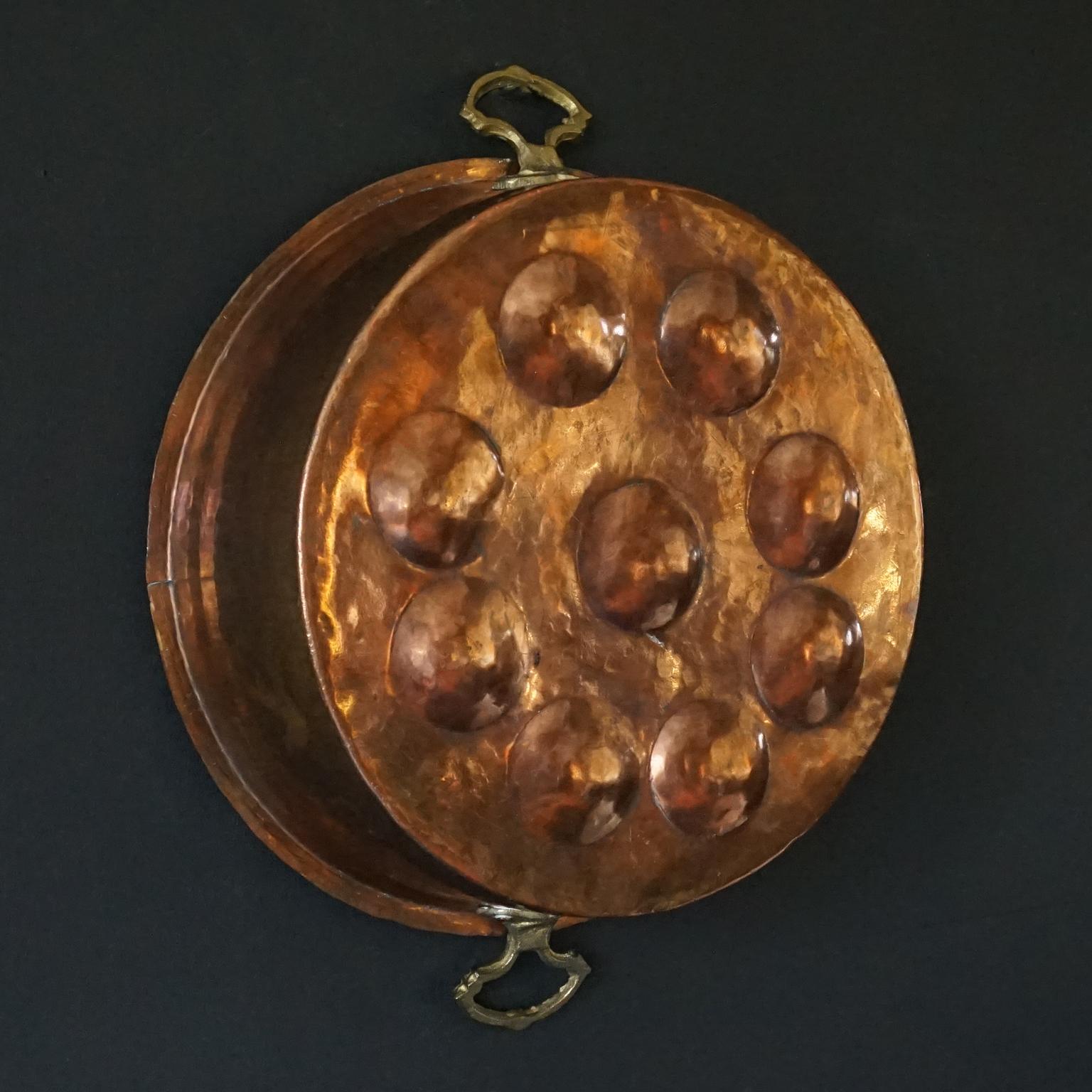 Collection of Fourteen 19th Century French Copper Egg Poacher or Escargot Pans For Sale 1
