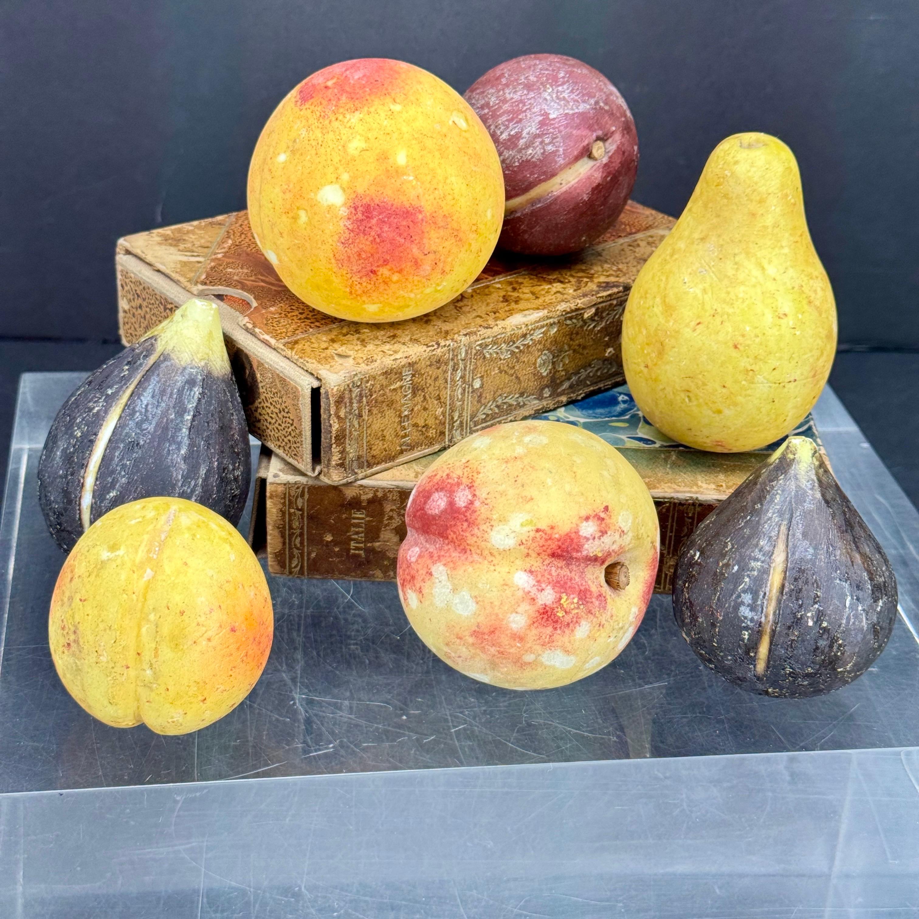 Bring timeless artistry to your home with this charming set of 7 antique Italian Alabaster Fruits. The set features 2 figs, a plum, 2 peaches and apricot and a pear-carved and have been painted by Italian artisans, each piece is a life-sized,