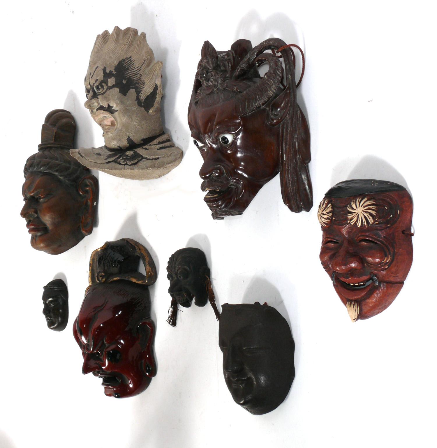 Collection of eight Japanese and Chinese masks, circa 1950s or earlier. These were recently purchased from the Manhattan estate of a Japanese man who traveled to Asia in the 1940s-1970s purchasing antiques. They retain their warm original patina.