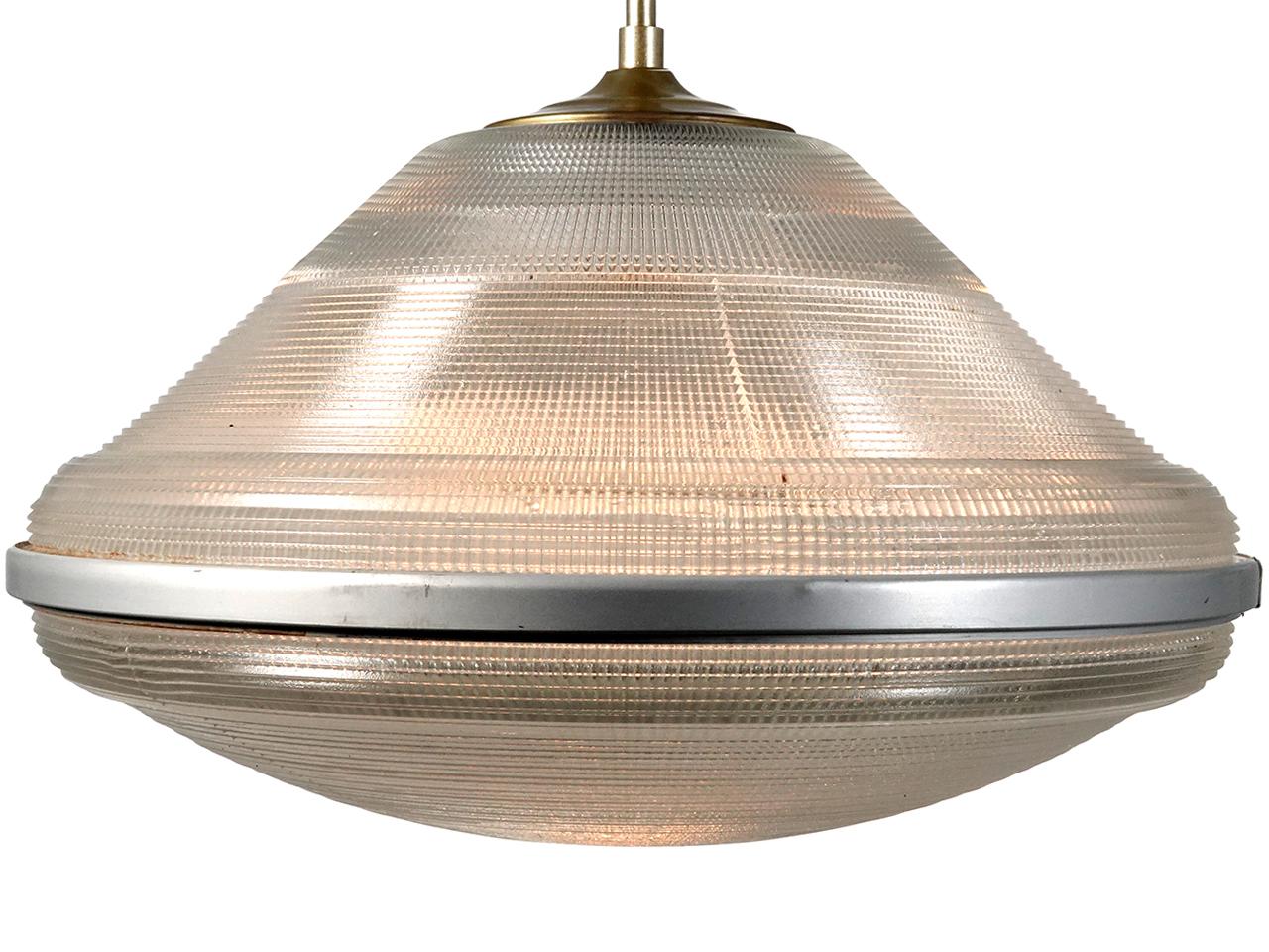 These amps have an impressive 20 inch diameter. That's a lot of glass. The prismatic glass is top and bottom creating a flattened saucer globe. The bottom half is a wide shallow bowl with a removable center disc for changing bulbs. The top is a wide