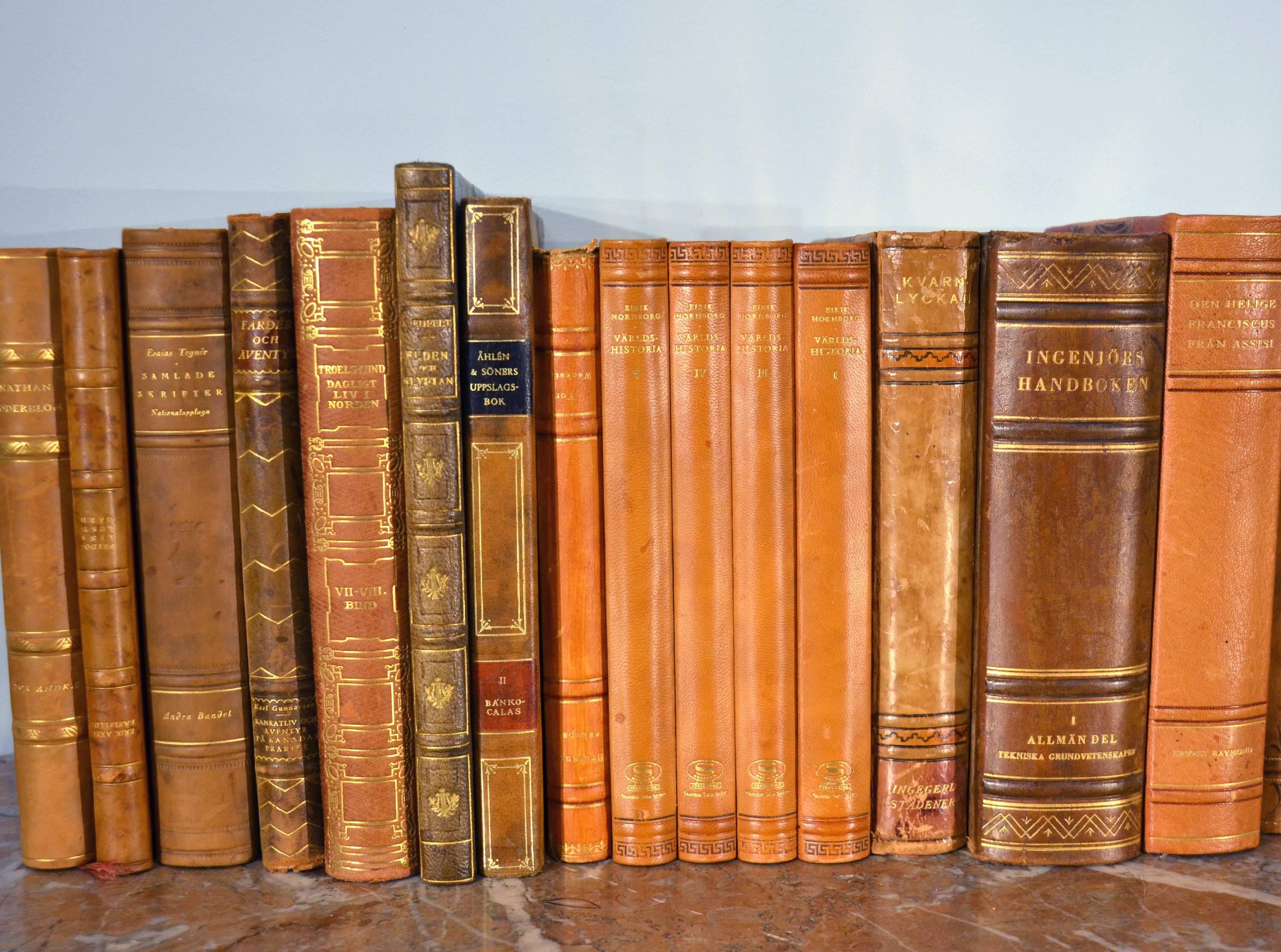 This large and very attractive collection of beautiful leather-bound Swedish Literature books contains 46 books in total, in warm rich tones of dark reddish tan, brown and old gold with gold leaf embossing. Aside from a few books that have minor