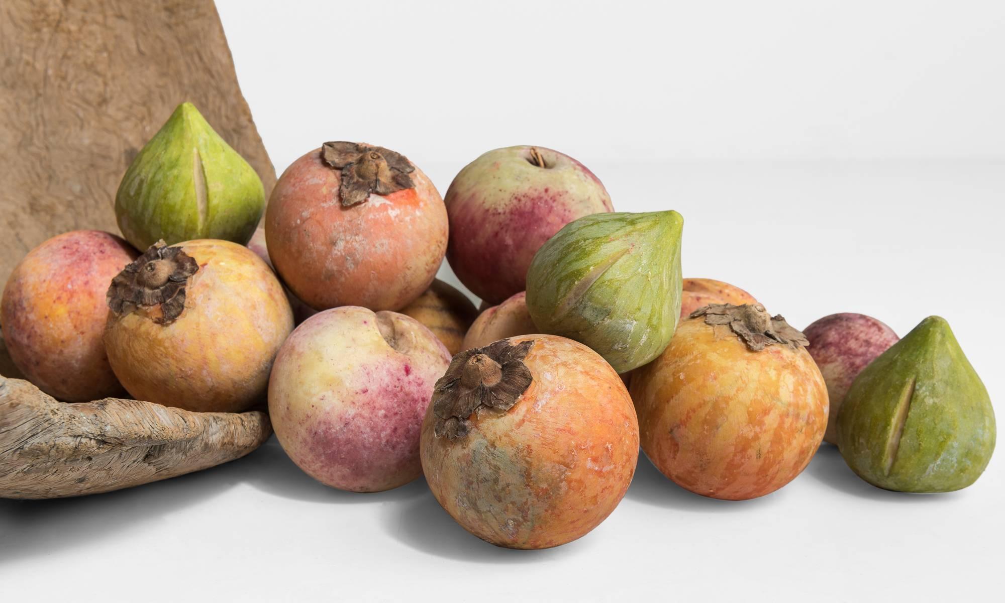 Collection of marble fruit, circa 1960.

Assortment of hand-carved and hand-painted collection of marble fruit, persimmons, apples, peaches and figs.