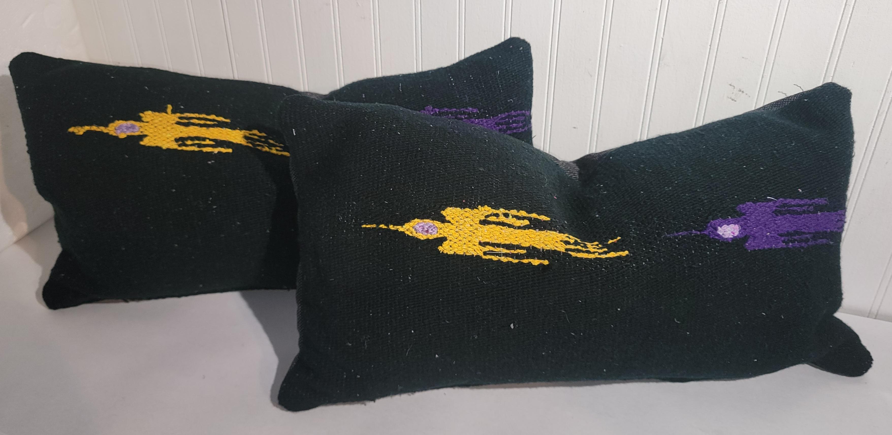 Collection of four bird pillows. Bird depict that of birds in flight. The birds are yellow, purple, red and turquoise. The pillows are a thicker wool Mexican weave that was made into pillows. This is sold in a set of four. 

Please ask is any