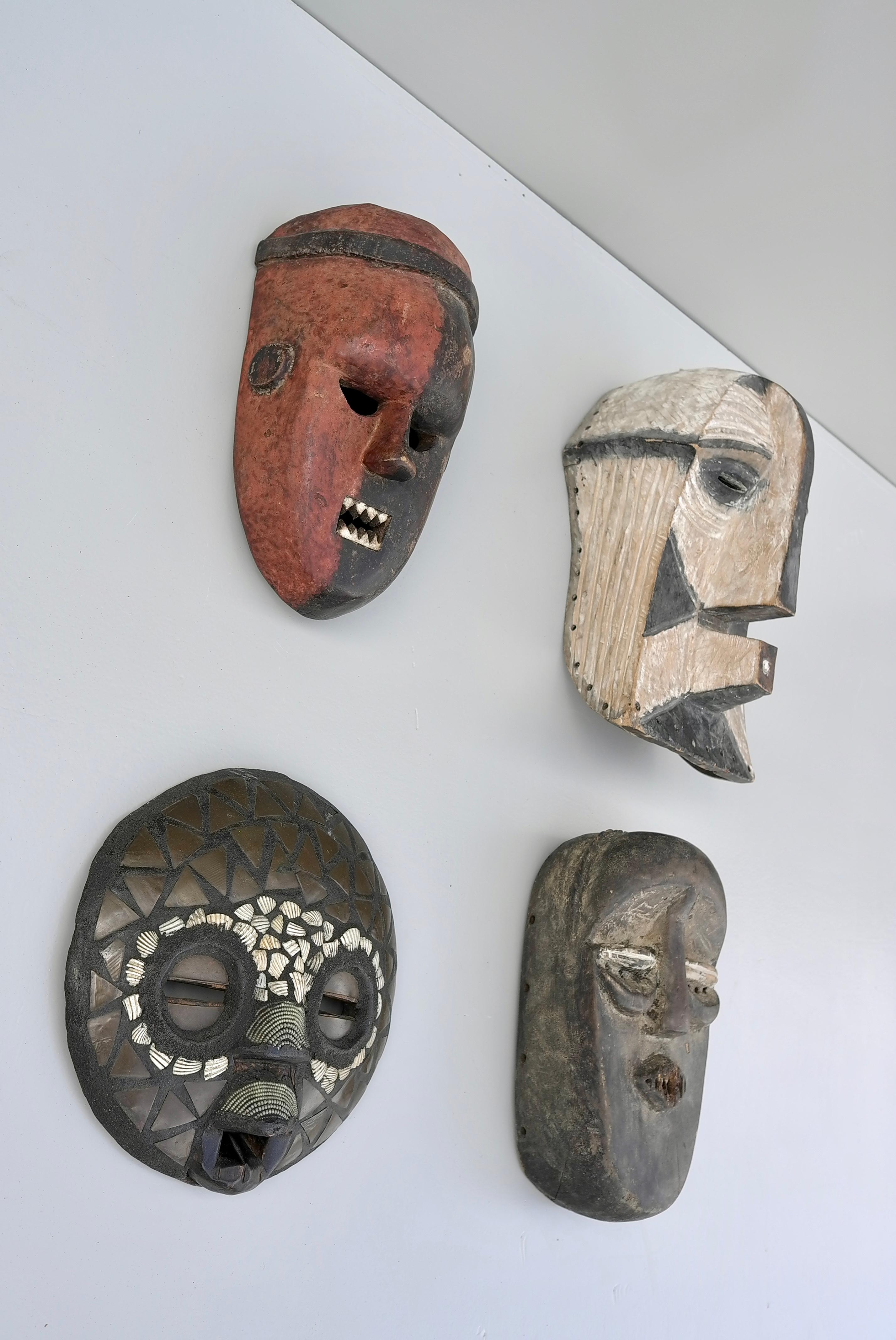 Mid-Century Modern Collection of Mid-Century African Multicolored Wooden Masks For Sale