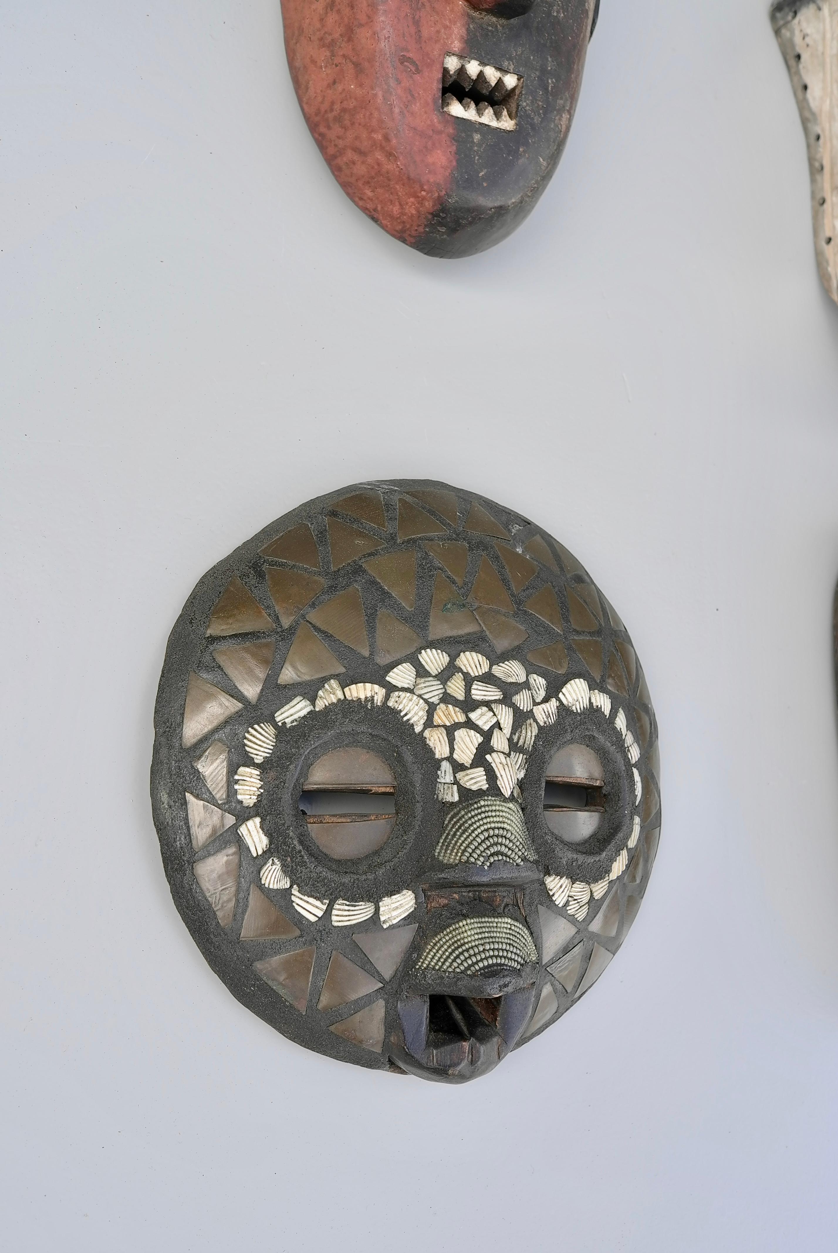 Mid-20th Century Collection of Mid-Century African Multicolored Wooden Masks For Sale