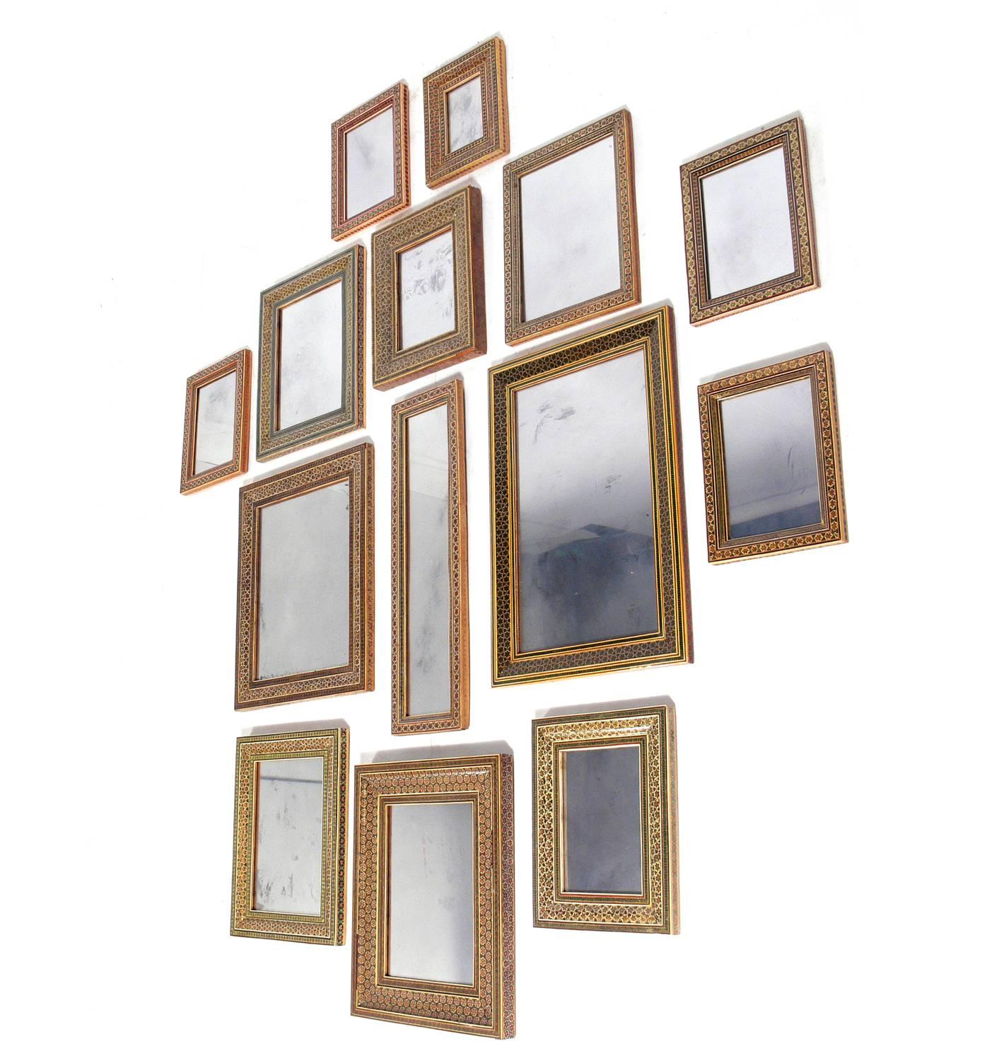 Collection of Moroccan Mosaic Framed Mirrors, circa 1960s. Each mirror frame is hand made with the painstaking precision of tiny inlaid mosaic pieces. The price listed is for the entire collection of 14 mirrors. We will not break up the collection.