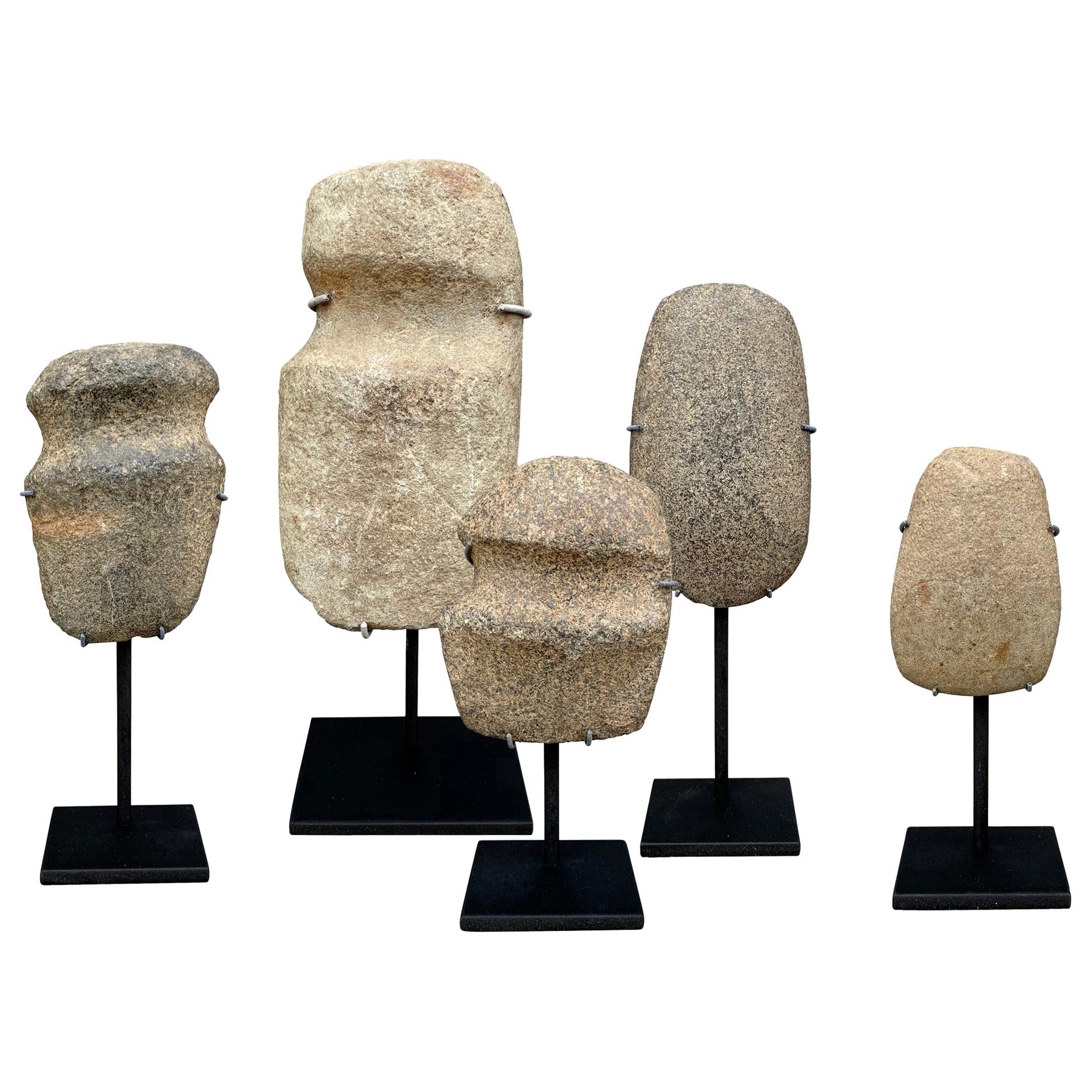 Collection of Neolithic Stone Axe Heads on Stands