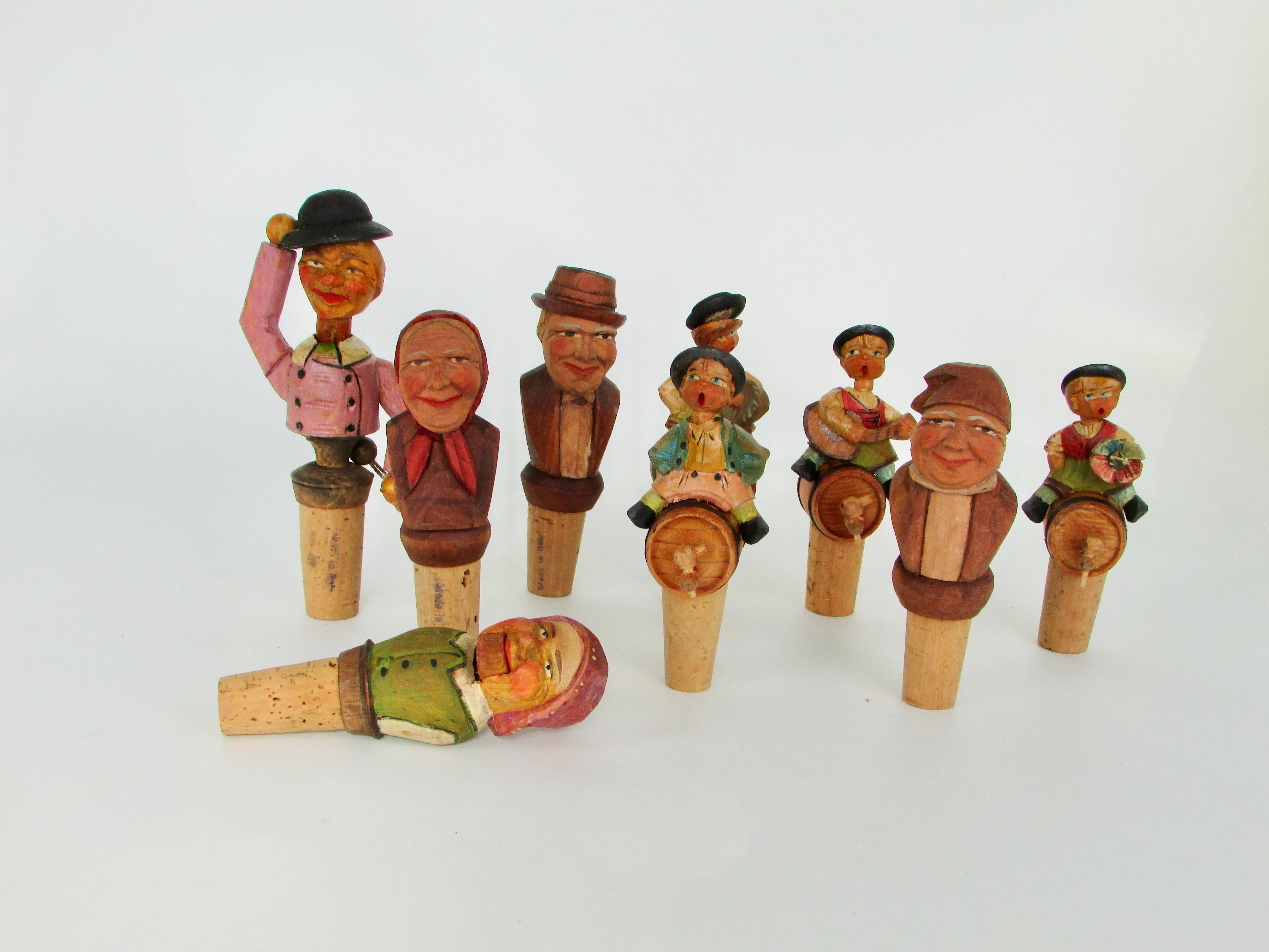 Bohemian Collection of nine Anri Italian hand carved figural bottle toppers  For Sale