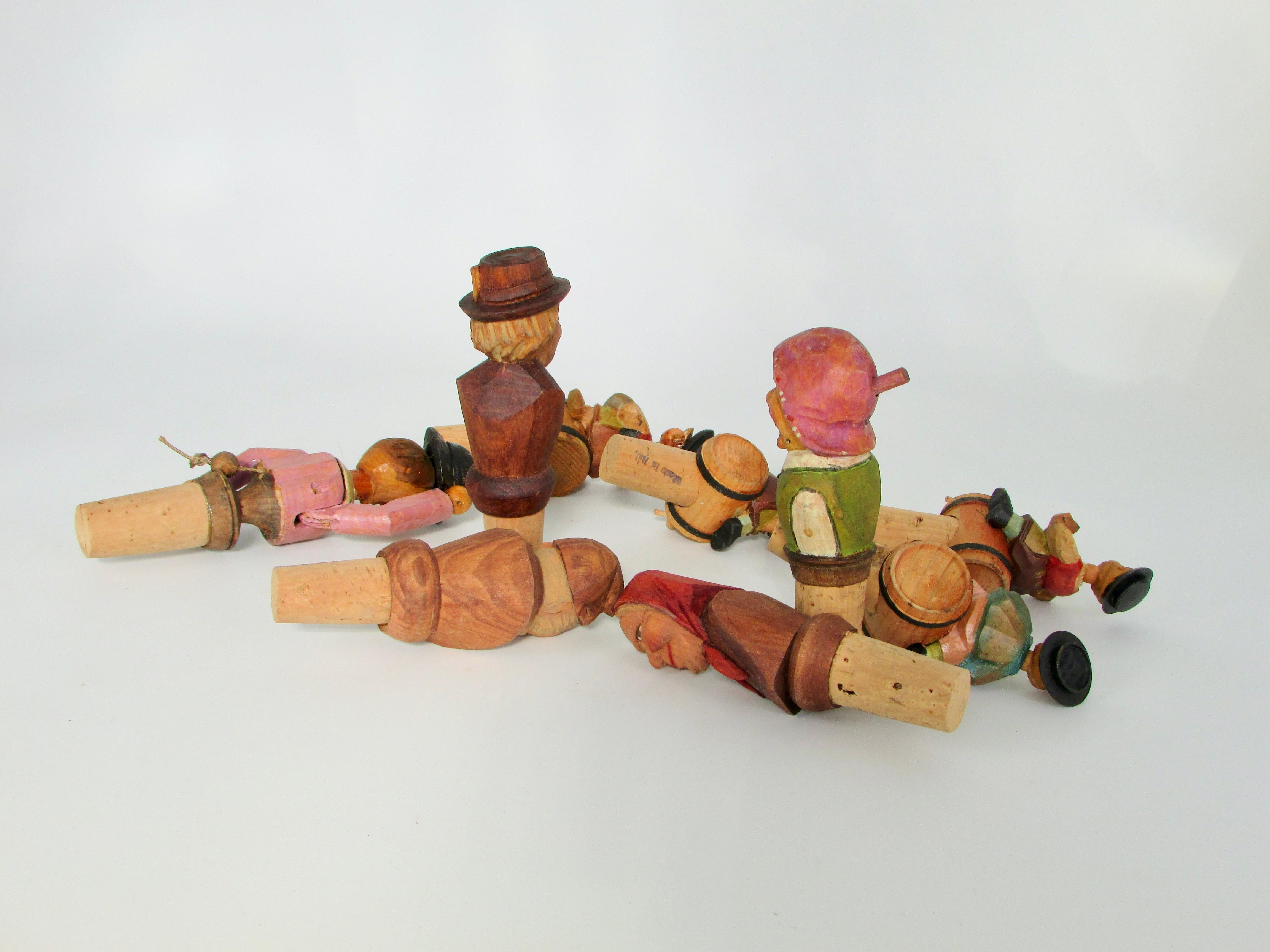Hand-Carved Collection of nine Anri Italian hand carved figural bottle toppers  For Sale