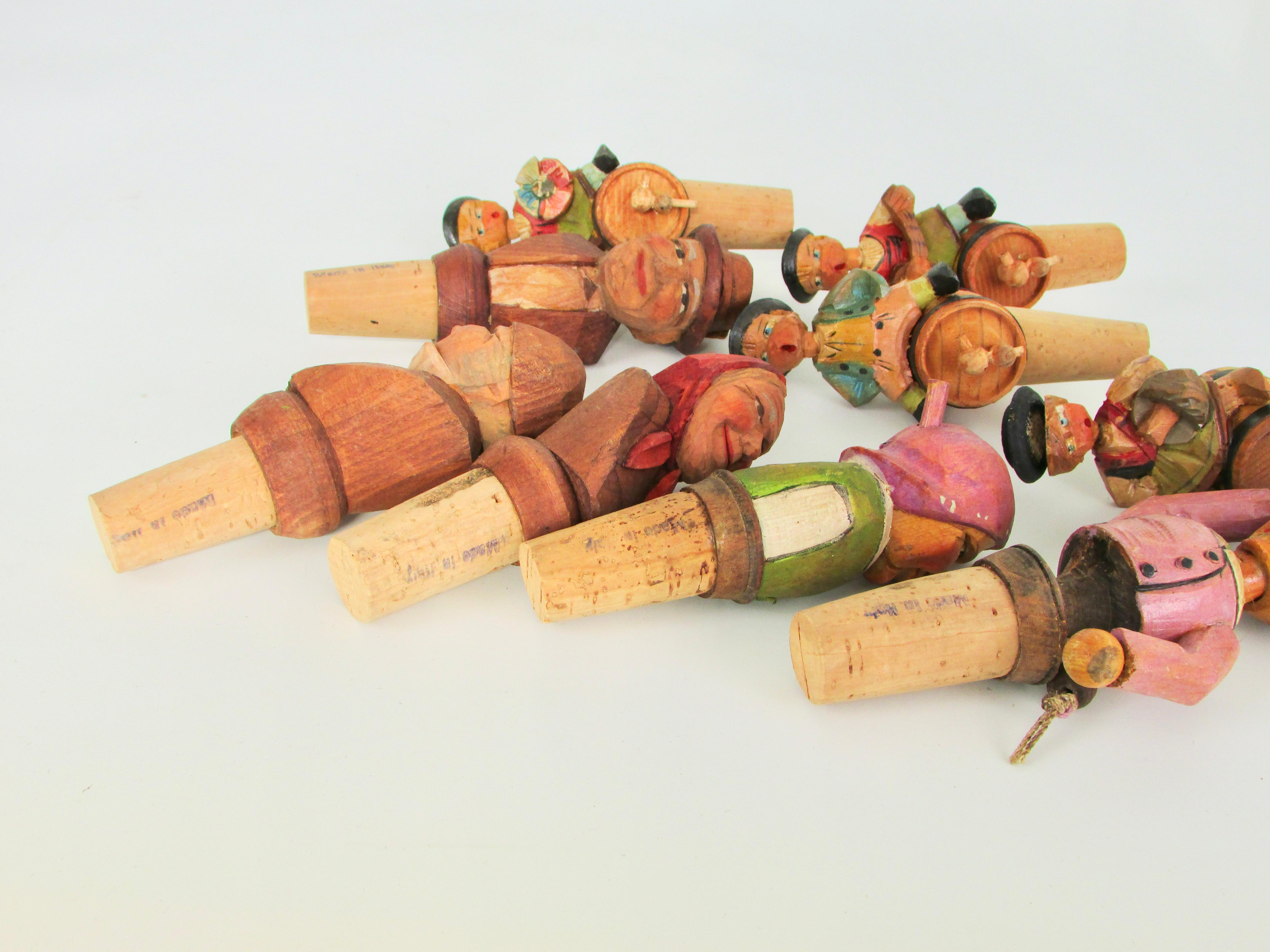 20th Century Collection of nine Anri Italian hand carved figural bottle toppers  For Sale