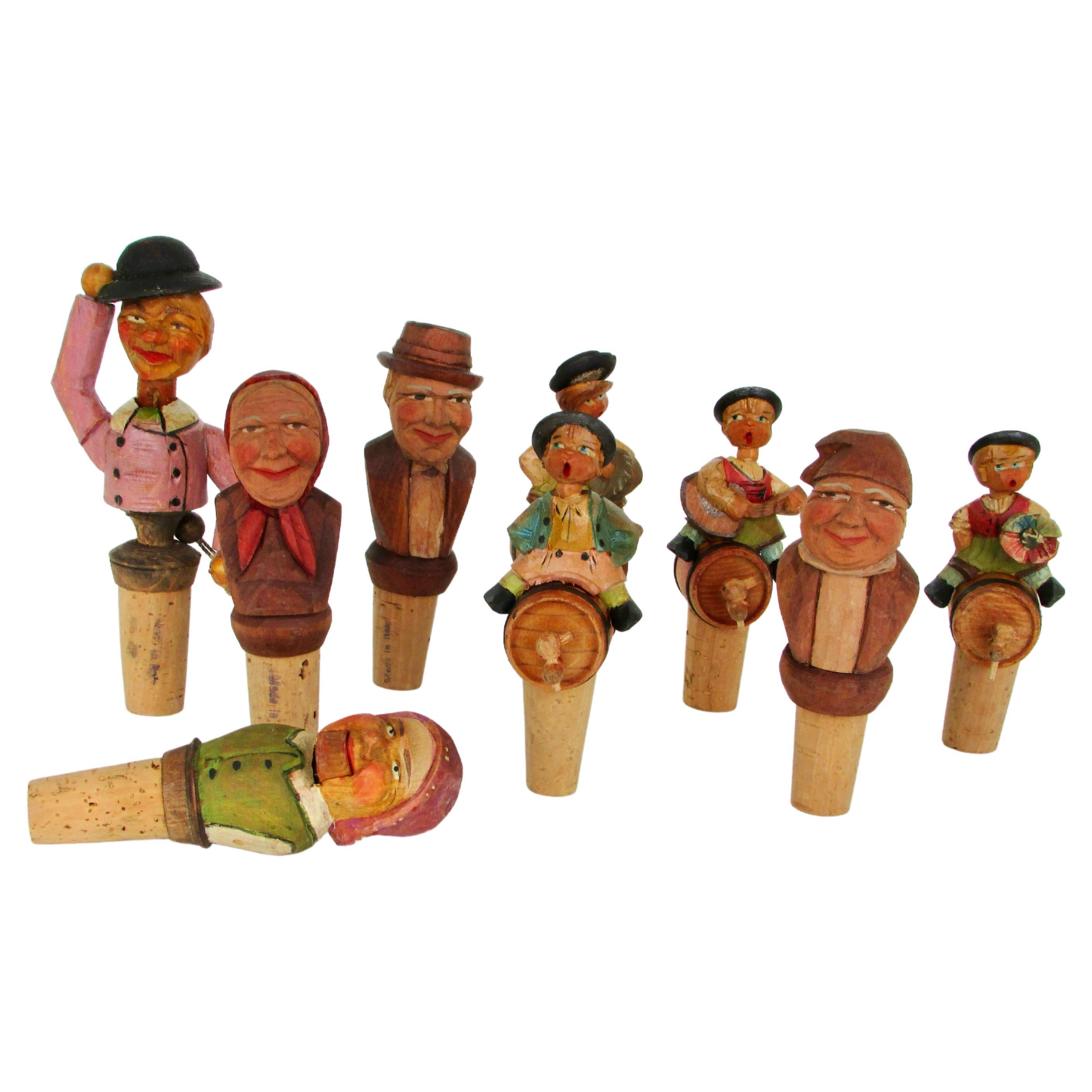 Collection of nine Anri Italian hand carved figural bottle toppers  For Sale