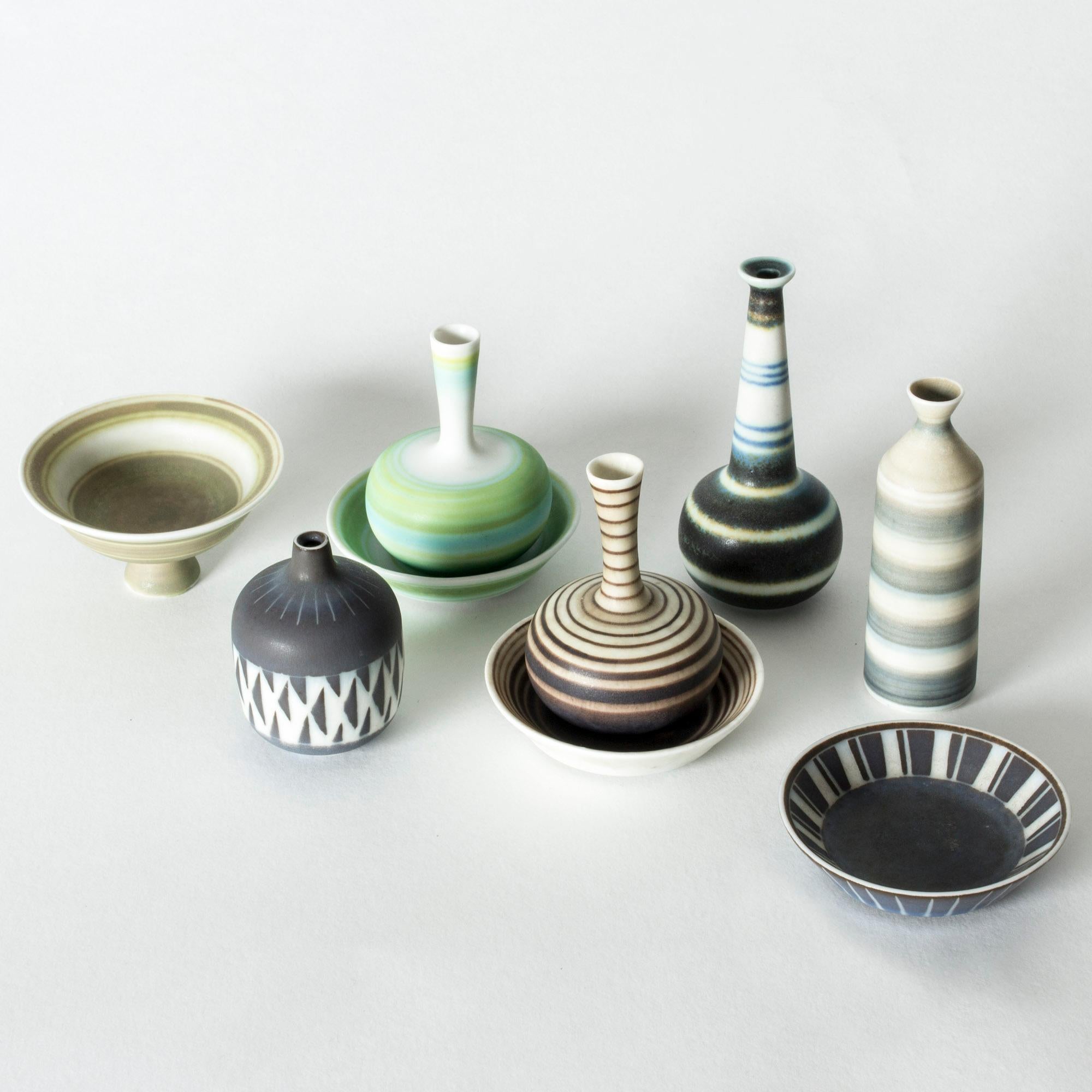 Collection of nine amazing miniature stoneware vases and platters by Gunnar Nylund. Made in matching forms, with a variety of colors and glazes, tied together by a graphic expression. Cool, fun and cute!

Sizes: Height 2.2 to 11 cm, diameter 3.2