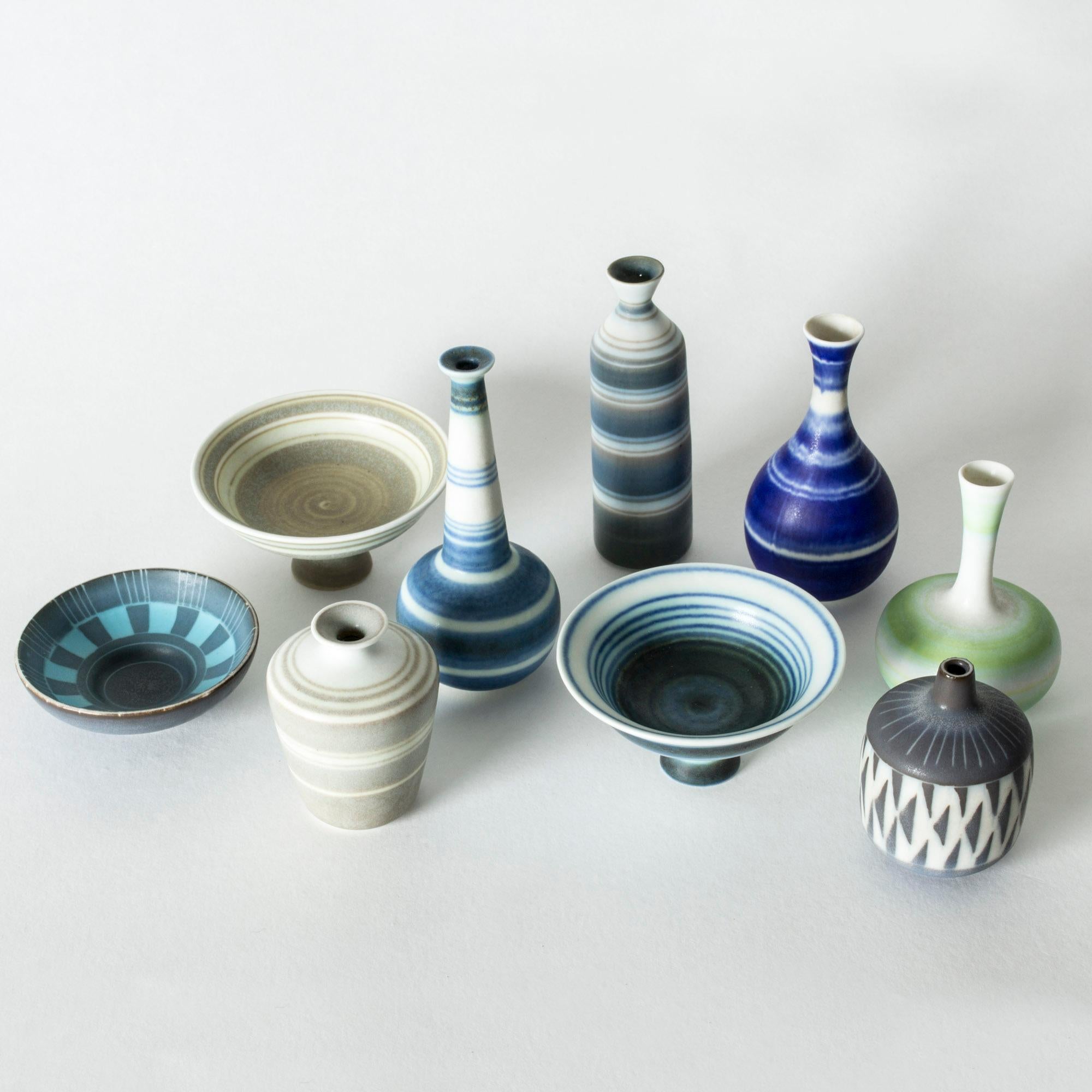Collection of nine amazing miniature stoneware vases and platters by Gunnar Nylund. Made in matching forms, with a variety of colors and glazes, tied together by a graphic expression. Cool, fun and cute!

Sizes: Height 2.2-11 cm, diameter 3.2-8 cm.